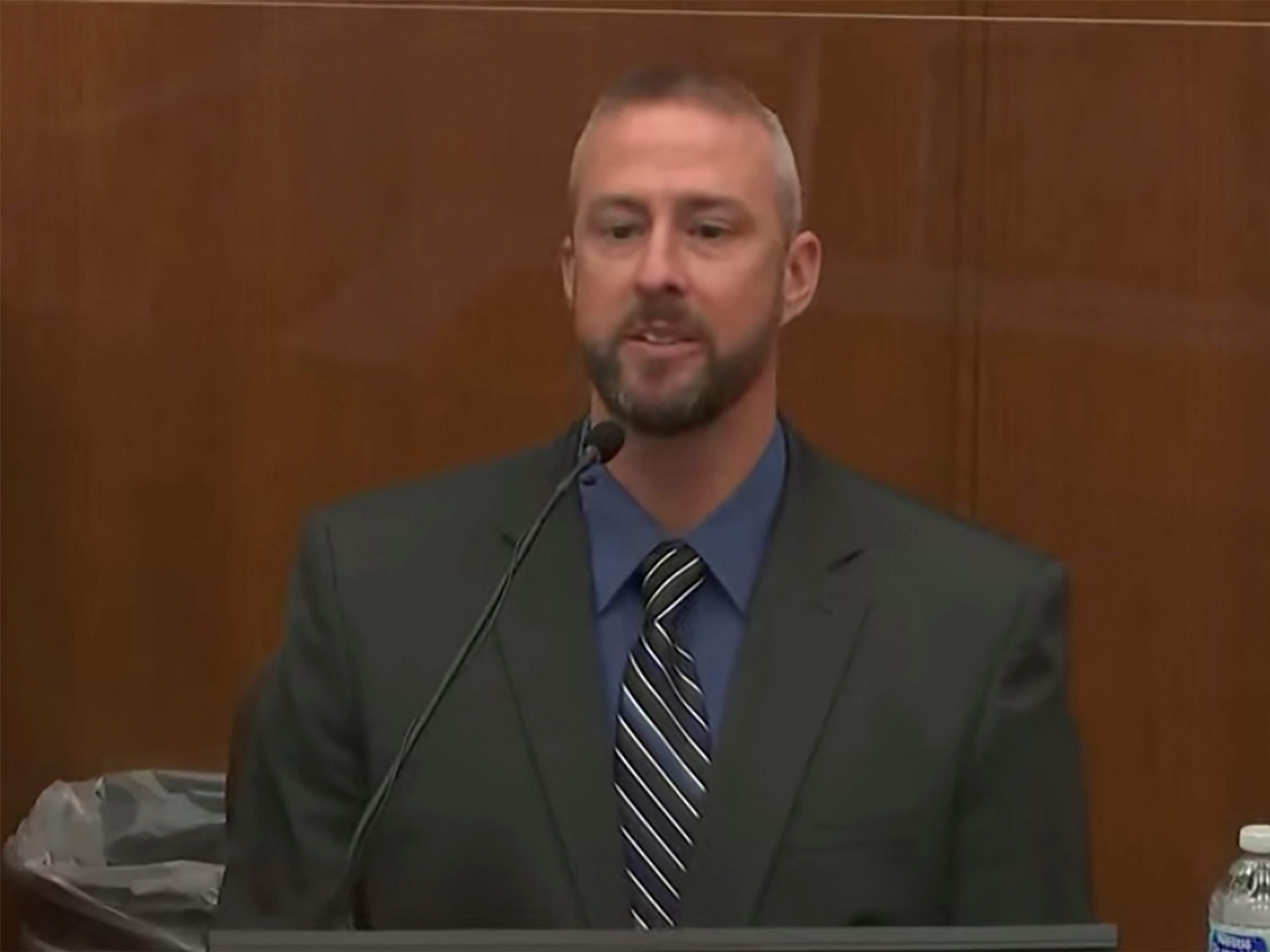 In this screen grab from video, Mychal Johnson, former patrol sergeant at the Brooklyn Center Police Department, testifies as Hennepin County Judge Regina Chu presides over court Friday, Dec. 10, 2021, in the trial of former Brooklyn Center police Officer Kim Potter at the Hennepin County Courthouse.