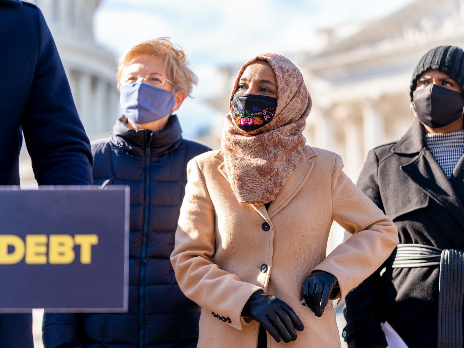 From left, Sen. Elizabeth Warren, D-Mass., Rep. Ilhan Omar, D-Minn., and Rep. Ayanna Pressley, D-Mass., appear at a news conference on Capitol Hill in Washington, Thursday, Feb. 4, 2021, about plans to reintroduce a resolution to call on President Biden to take executive action to cancel up to $50,000 in debt for federal student loan borrowers.