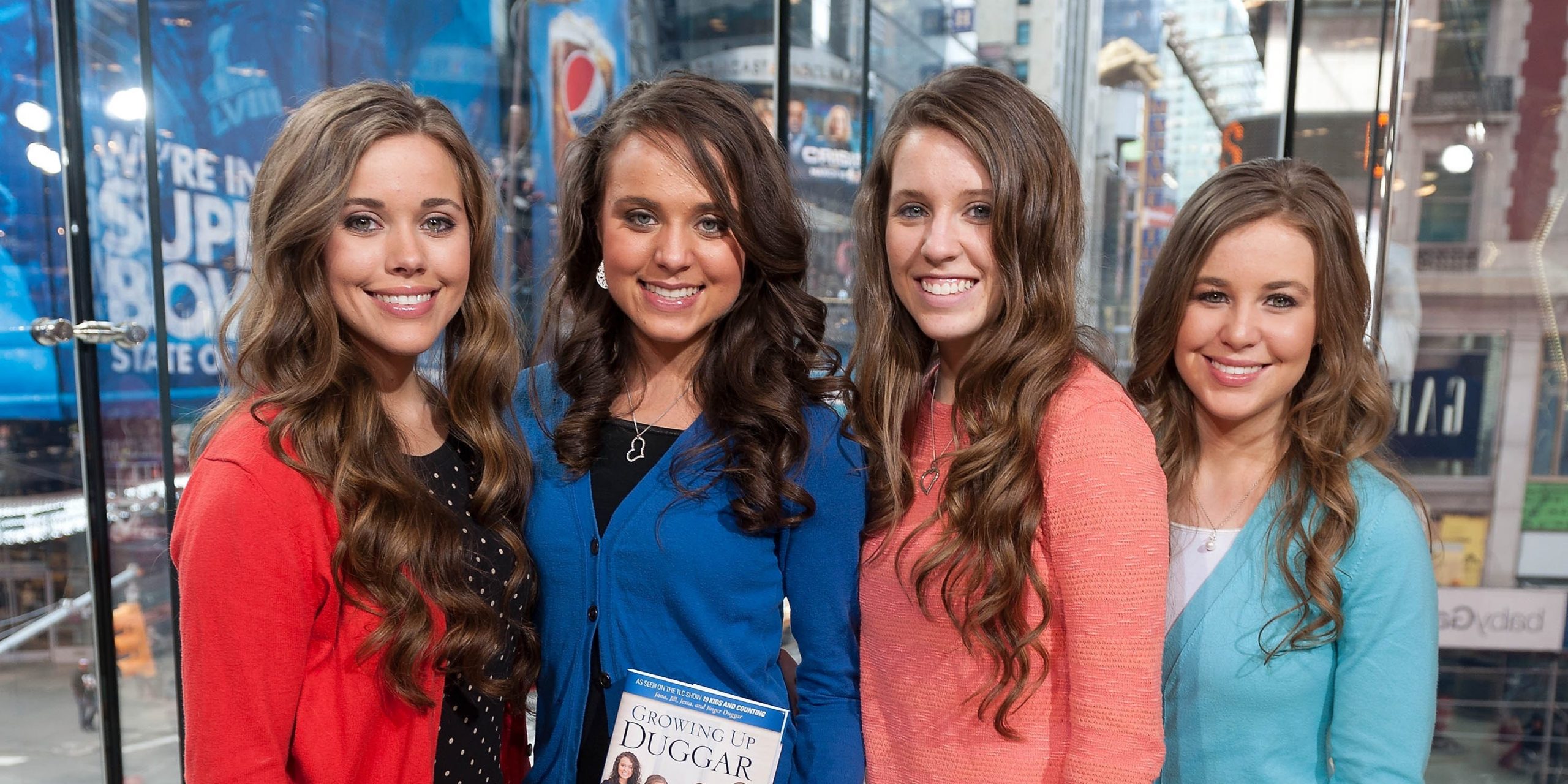 Jessa, Jinger, Jill, and Jana Duggar pose for a photo.