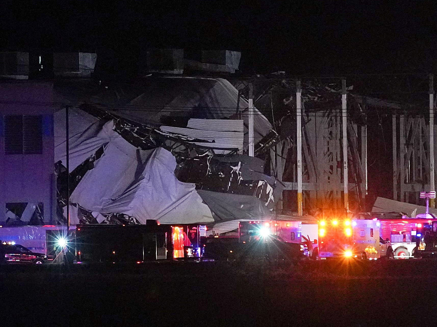 Emergency vehicles surround the site of an Amazon distribution warehouse with a collapsed roof, after storms hit the area of Edwardsville, Illinois, U.S. December 10, 2021.