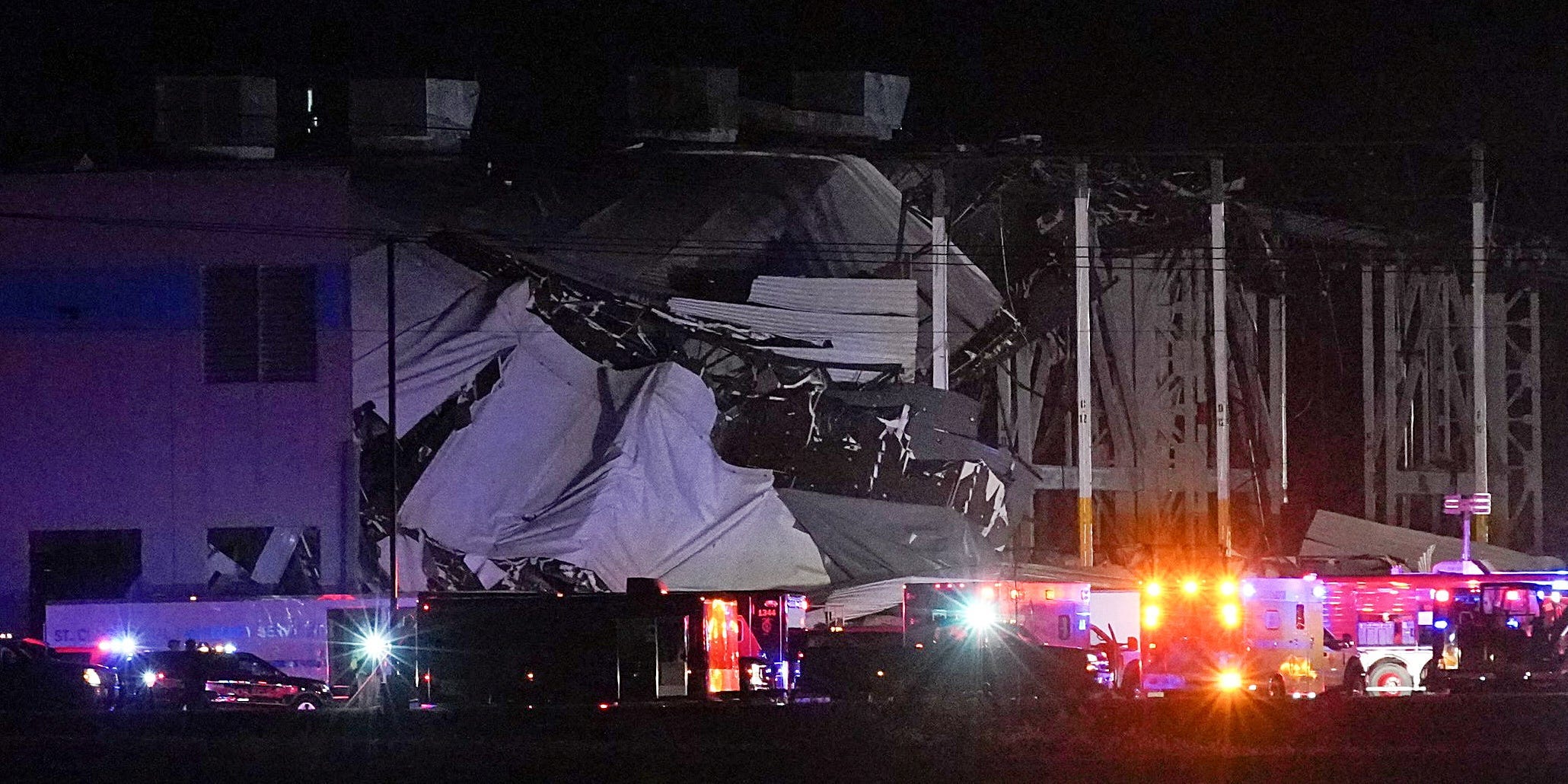 Emergency vehicles surround the site of an Amazon distribution warehouse in Edwardsville, Illinois with a collapsed roof, after storms hit the Midwest. December 10, 2021.