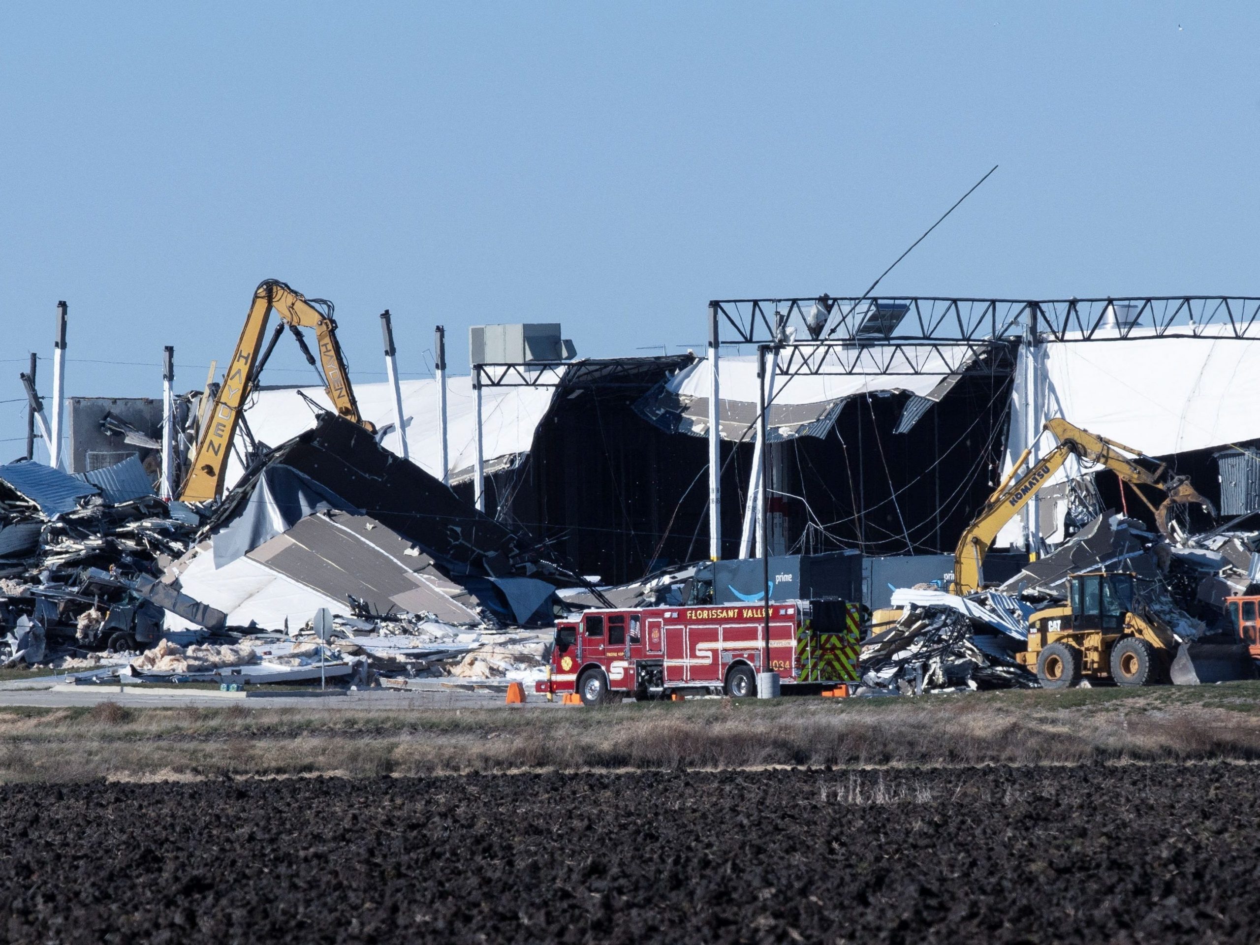 Construction crews work at the site of a roof collapse at an Amazon distribution center in Edwardsville, Illinois, US December 11, 2021.