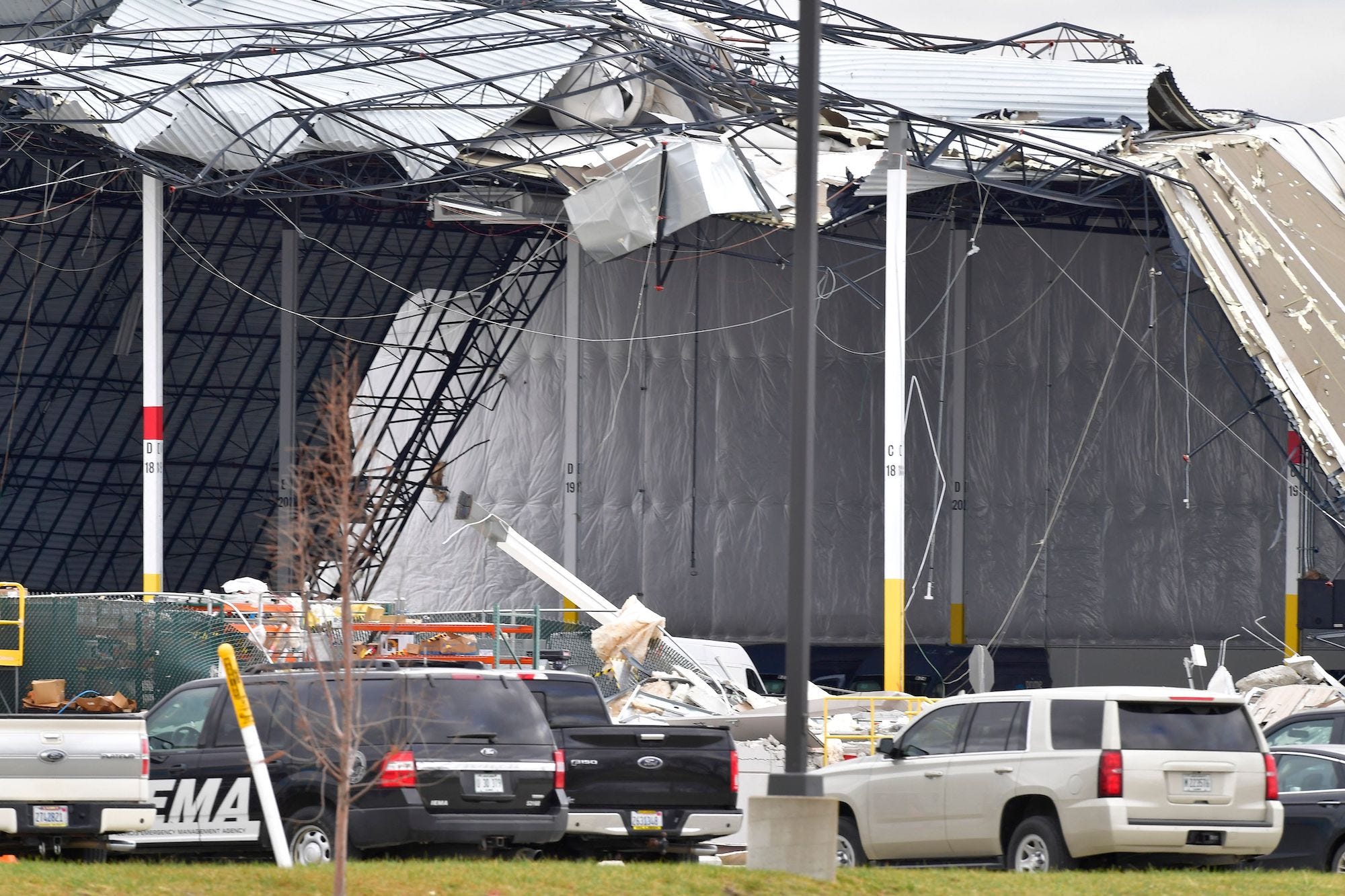 Workers removed debris after a tornado destroys an Amazon warehouse in Illinois.
