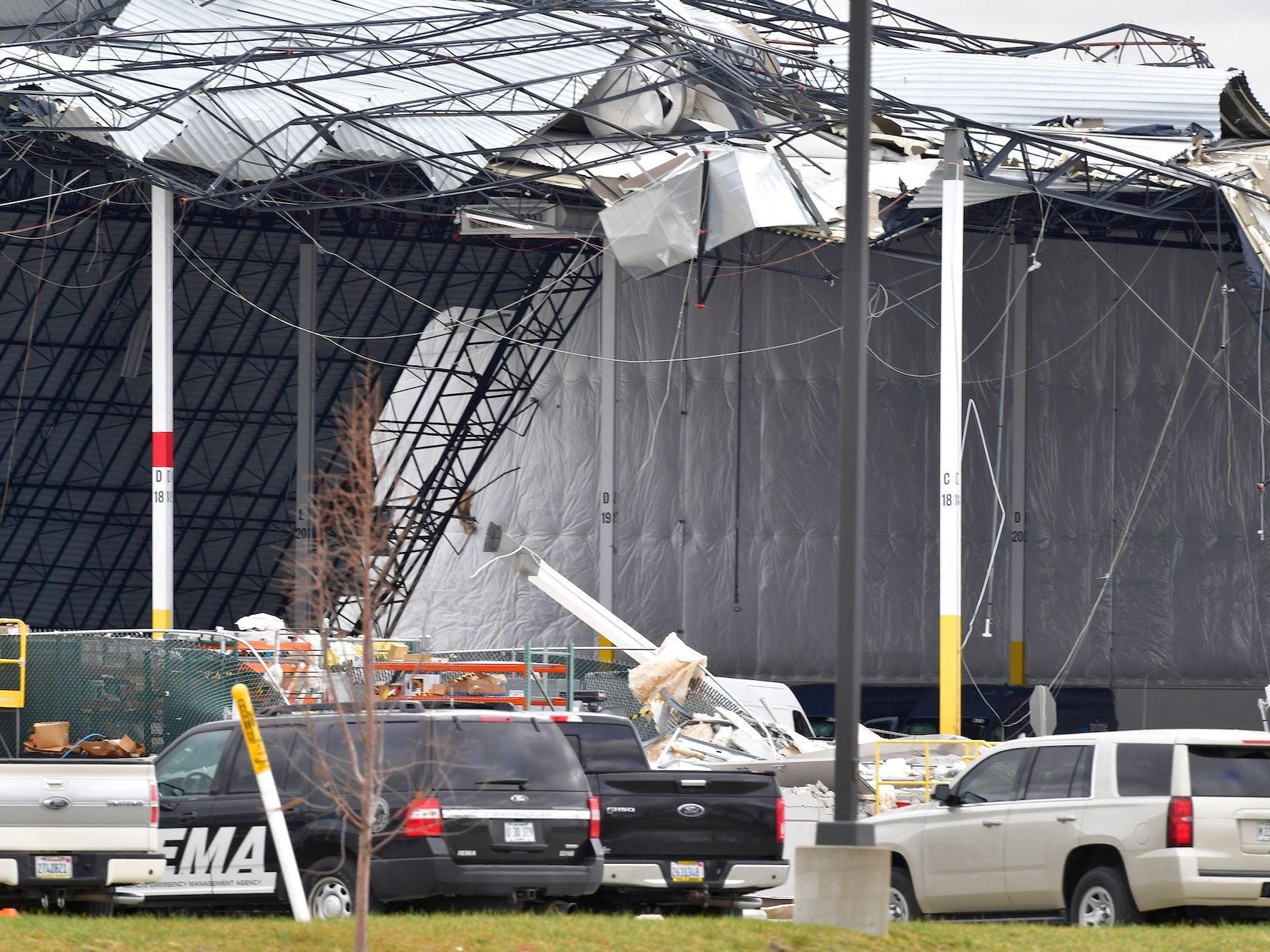 Workers removed debris after a tornado destroys an Amazon warehouse in Illinois.