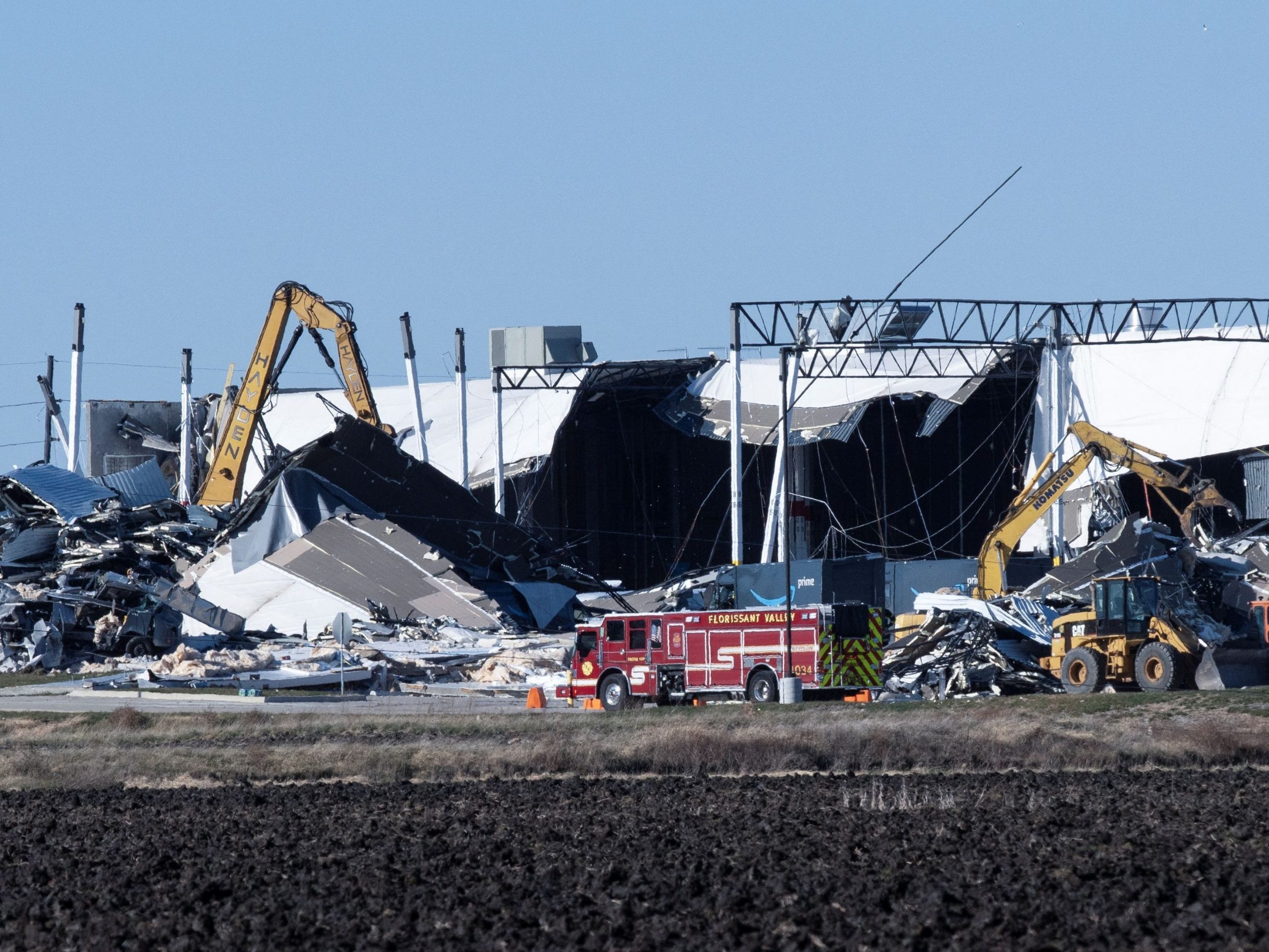 Construction crews work at the site of a roof collapse at an Amazon distribution center in Edwardsville, Illinois, US December 11, 2021.