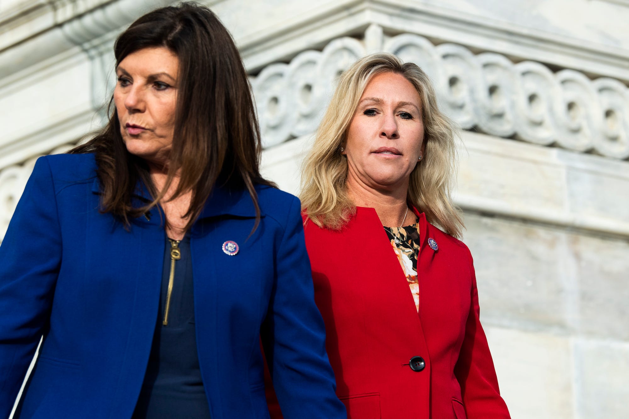 GOP Reps. Diana Harshbarger (left) and Marjorie Taylor Greene (right) pose for pictures on the steps of the US Capitol on freshman picture day.