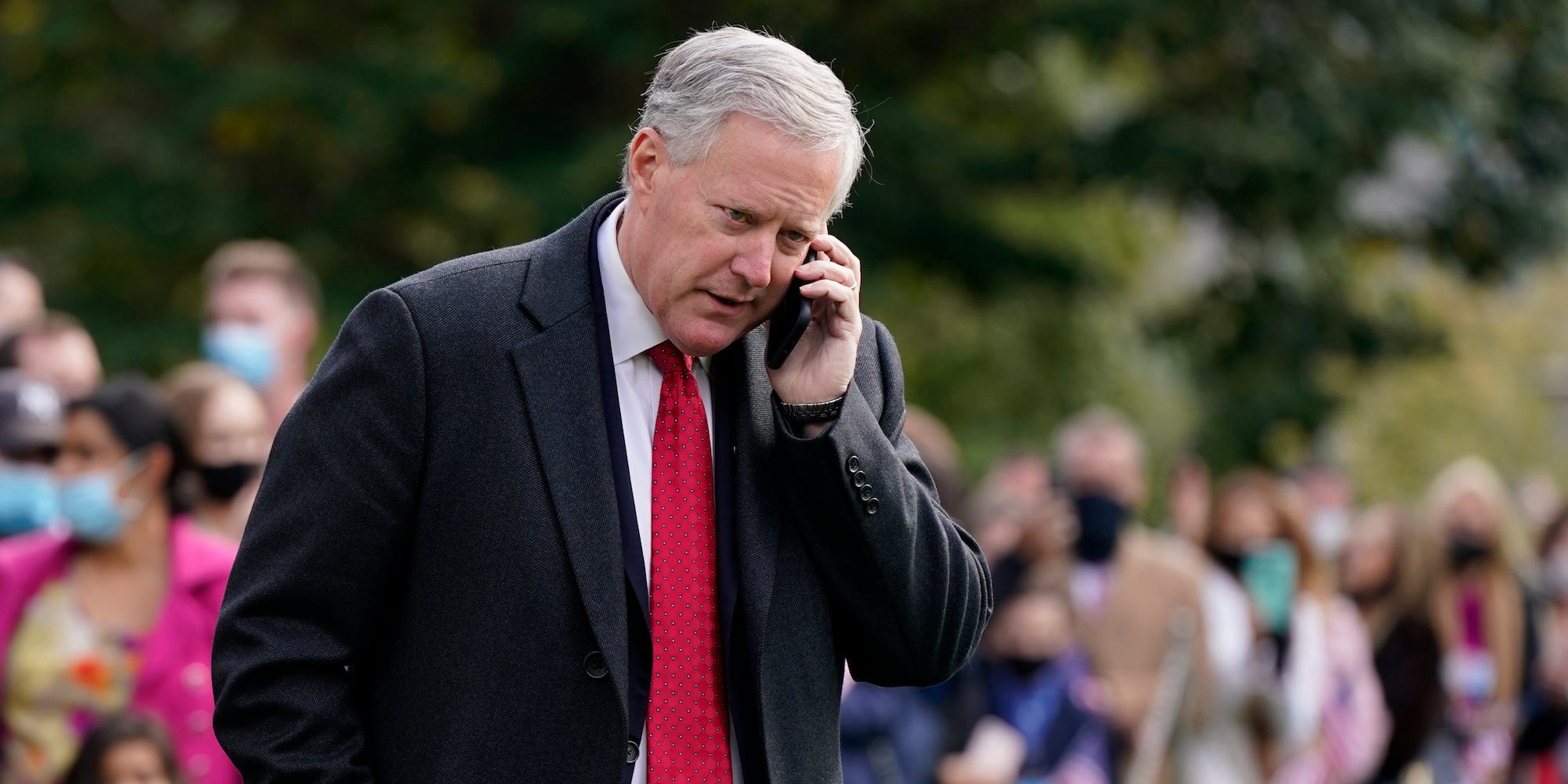 Former White House chief of staff Mark Meadows speaks on a phone on the South Lawn of the White House in Washington, on Oct. 30, 2020.