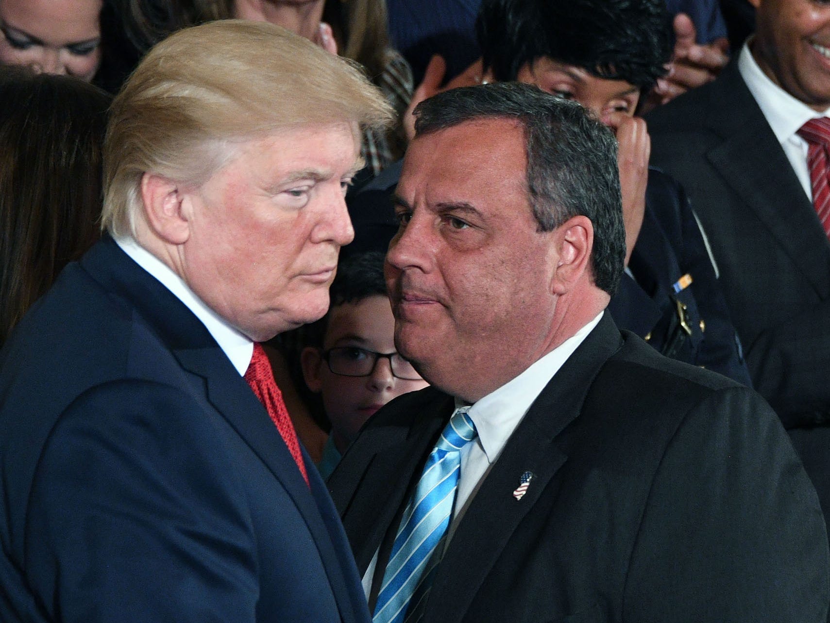 Former New Jersey Gov. Chris Christie speaks with former President Donald Trump at a White House event on October 26, 2017.