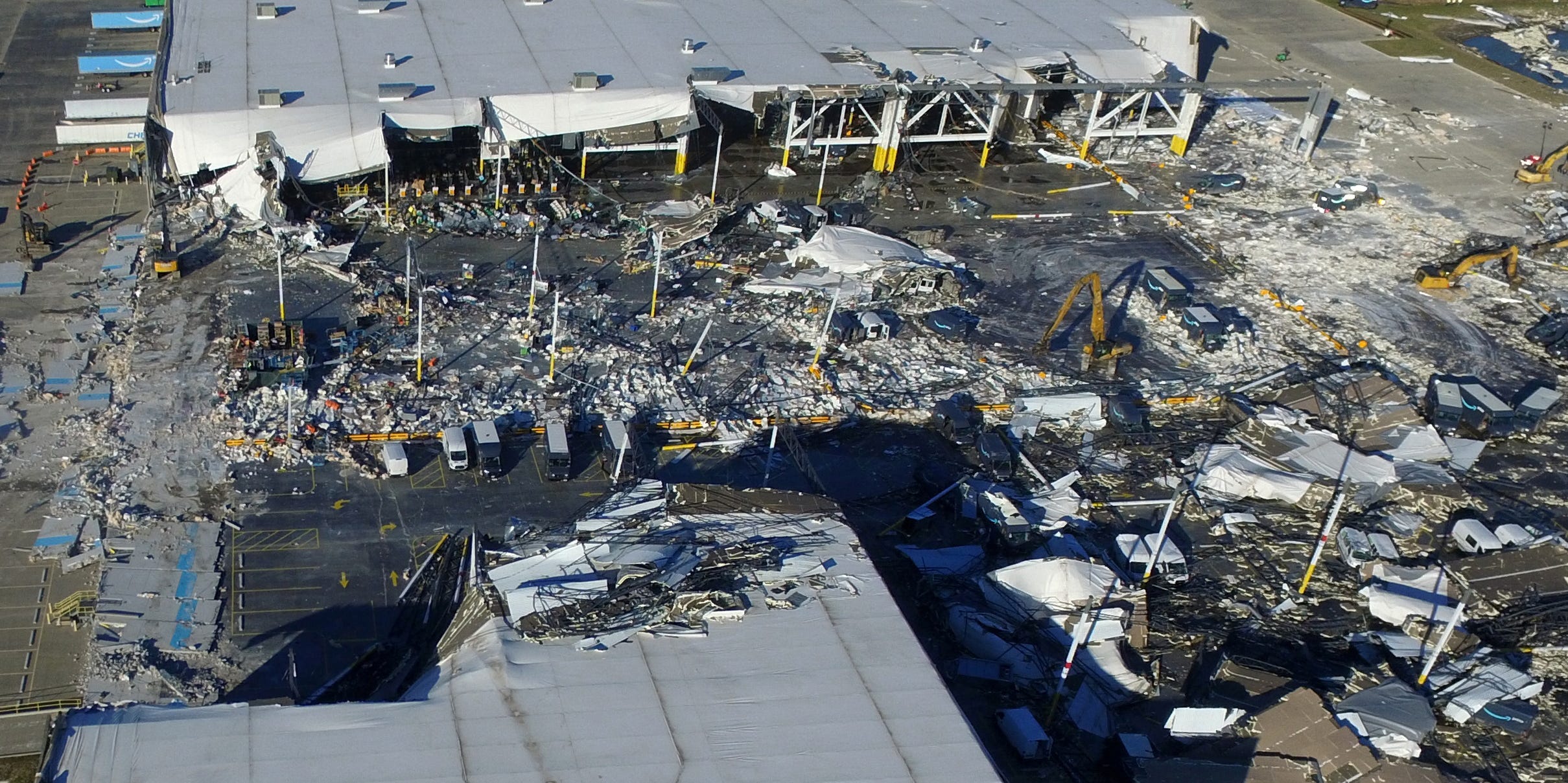 The collapsed roof of an distribution centre after tornadoes