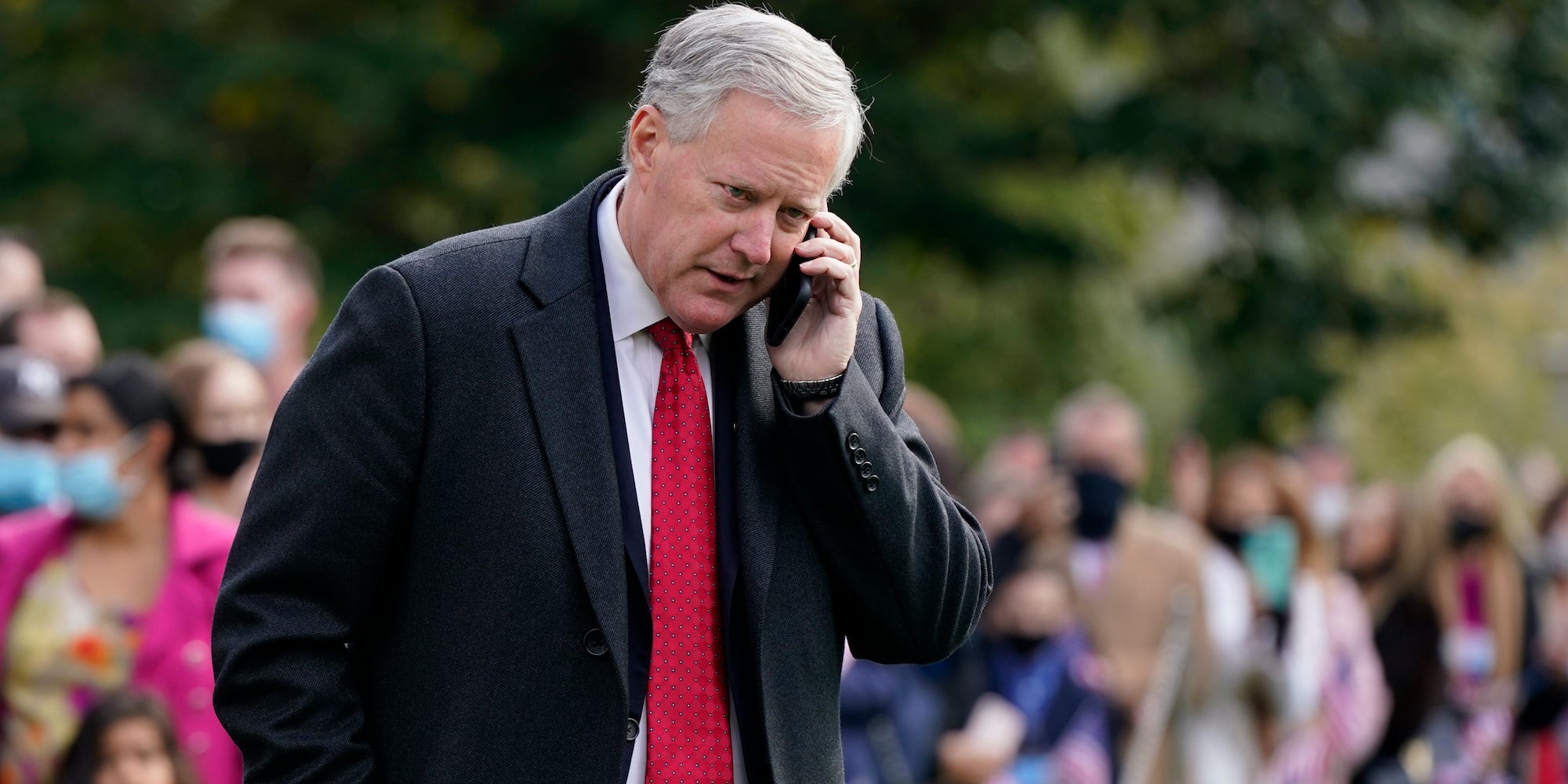 White House chief of staff Mark Meadows speaks on a phone on the South Lawn of the White House in Washington, on Oct. 30, 2020