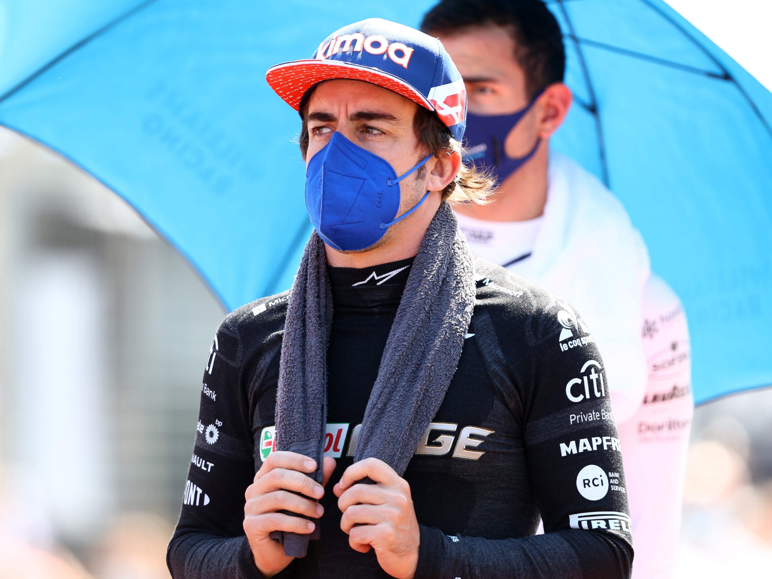 Fernando Alonso holds a towel round his neck