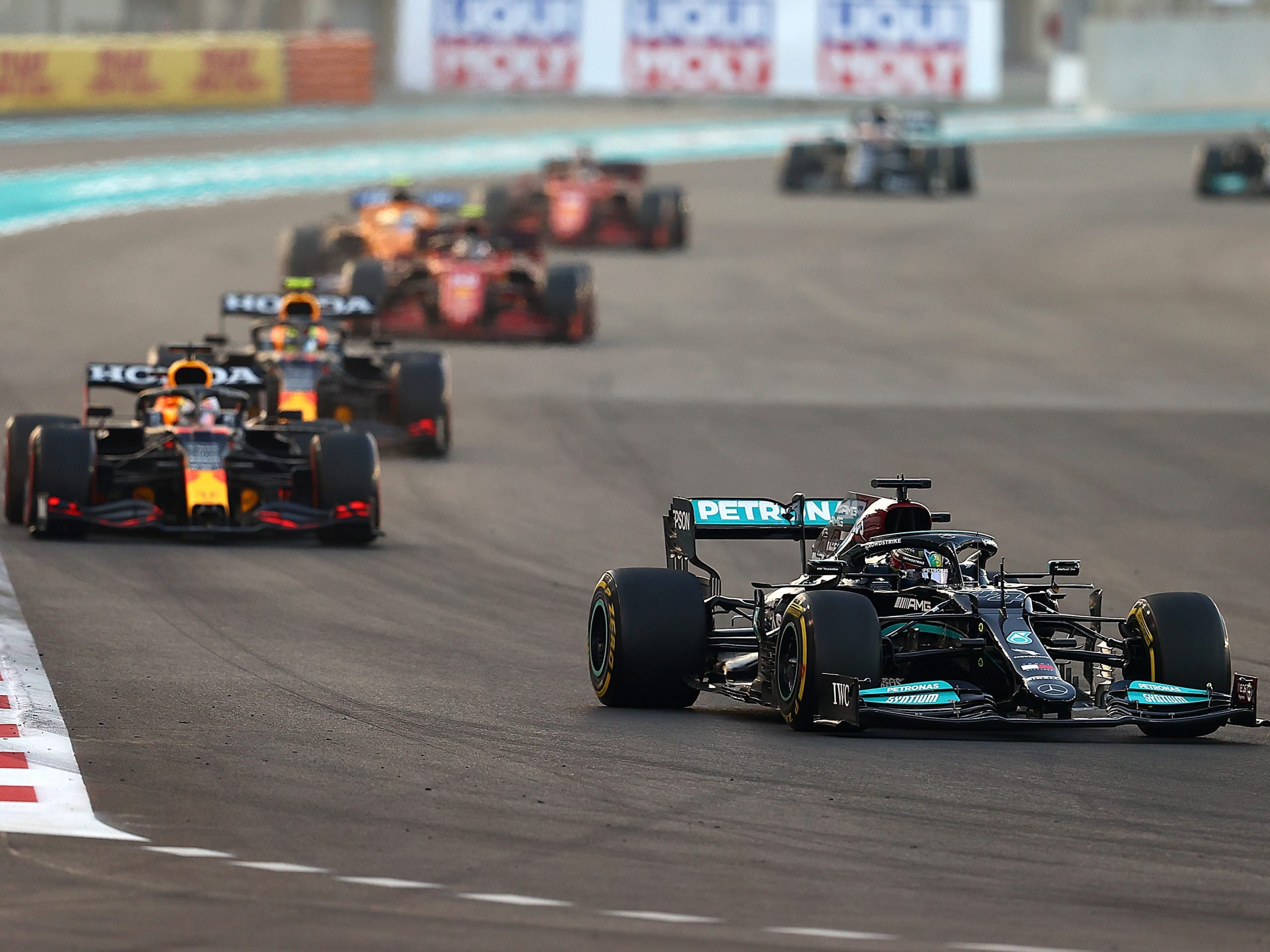 Lewis Hamilton drives ahead of Max Verstappen.