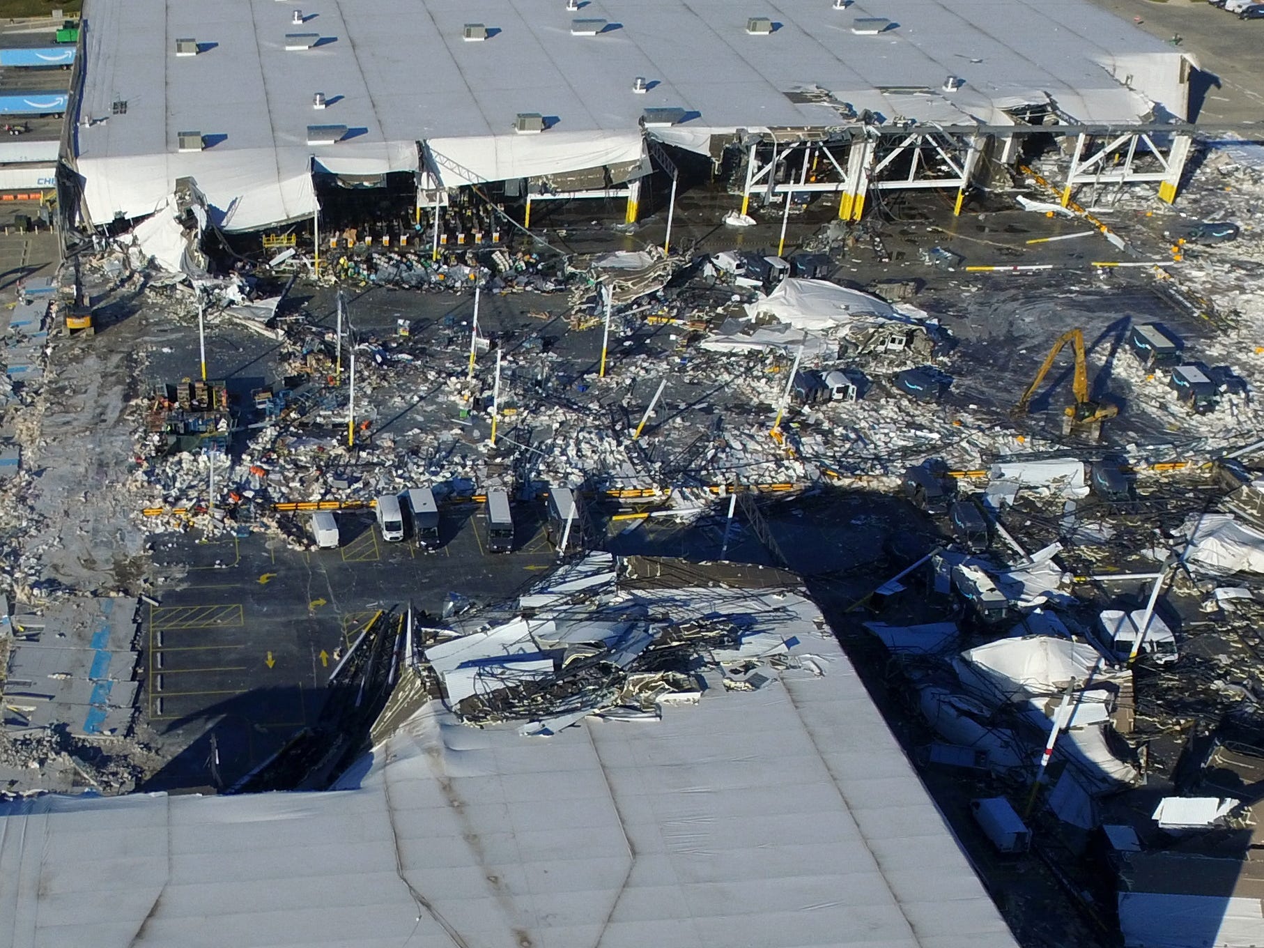 The collapsed roof of an distribution centre after tornadoes