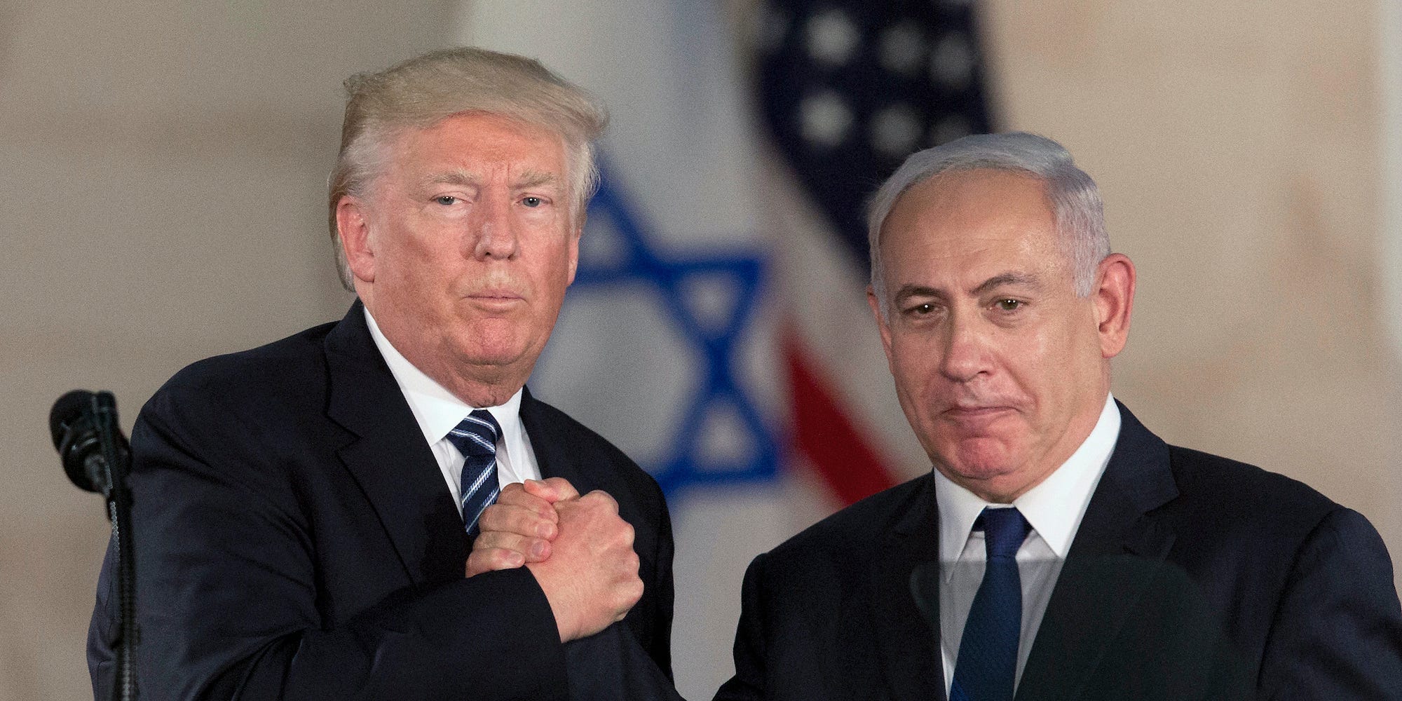 In this Tuesday, May 23, 2017 file photo, US President Donald Trump, left, shakes hands with Israeli Prime Minister Benjamin Netanyahu at the Israel Museum in Jerusalem