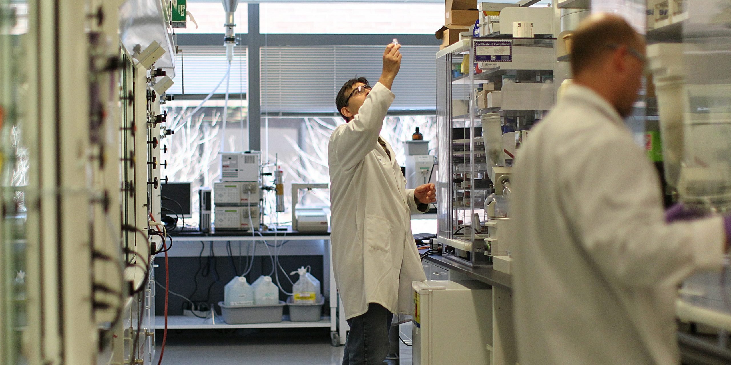 A Biogen employee works in the company's lab