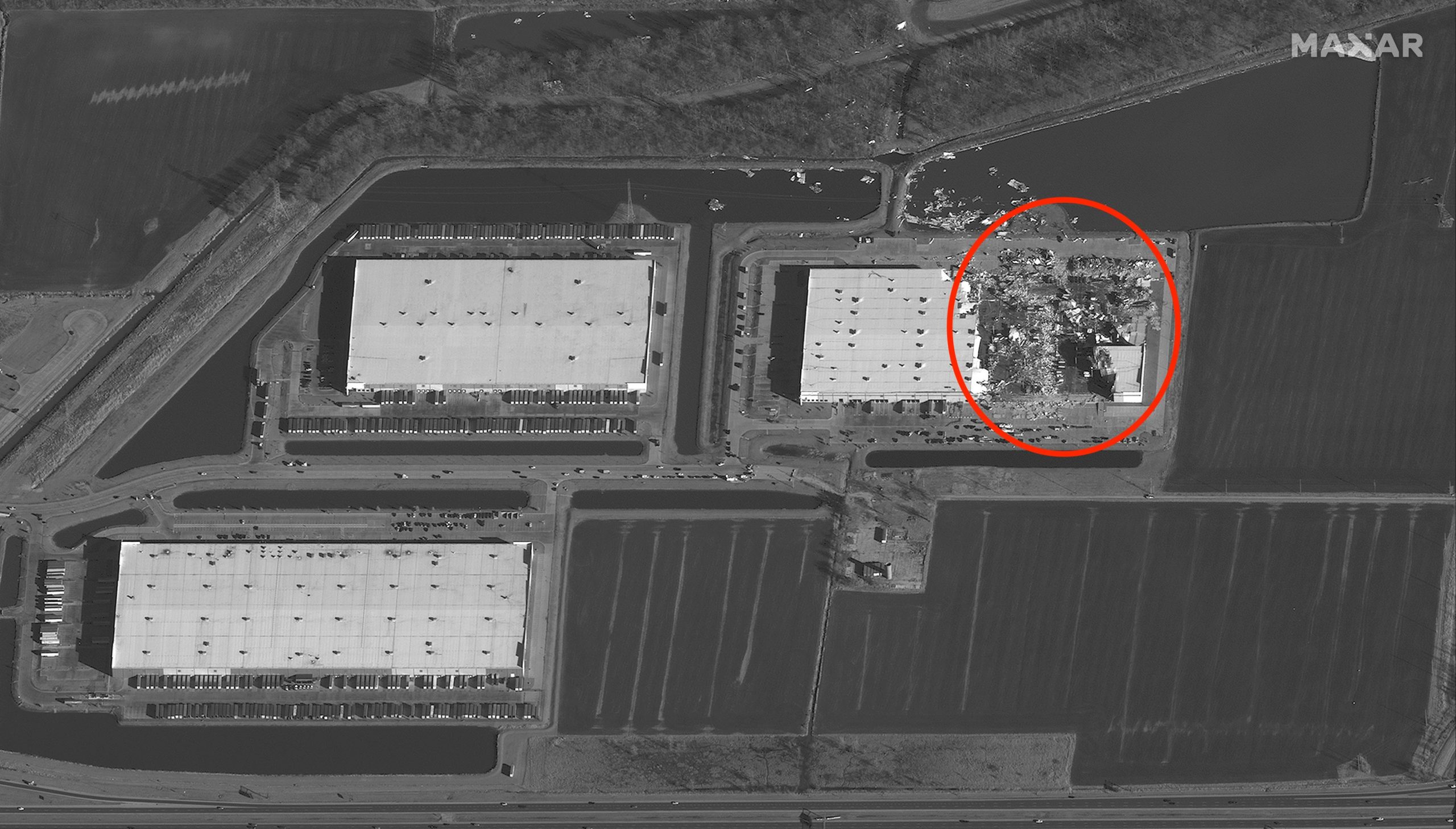 A December 11 satellite image shows the destruction of an Amazon facility in Edwardsville, Illinois, after a historic tornado toppled a large portion of the facility, leaving at least six dead.