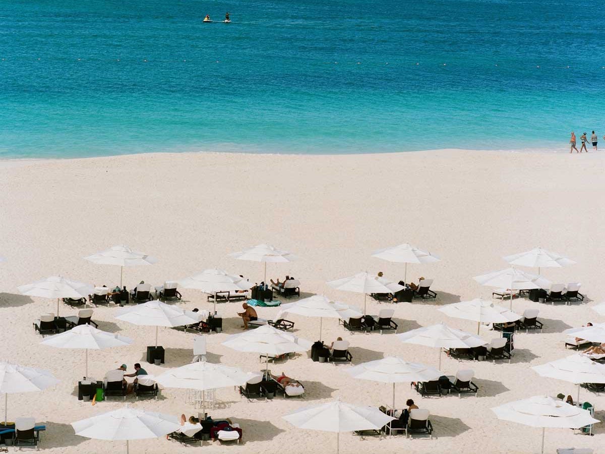 The beach with chairs and umbrellas at Bucuti & Tara Beach Resort in Aruba