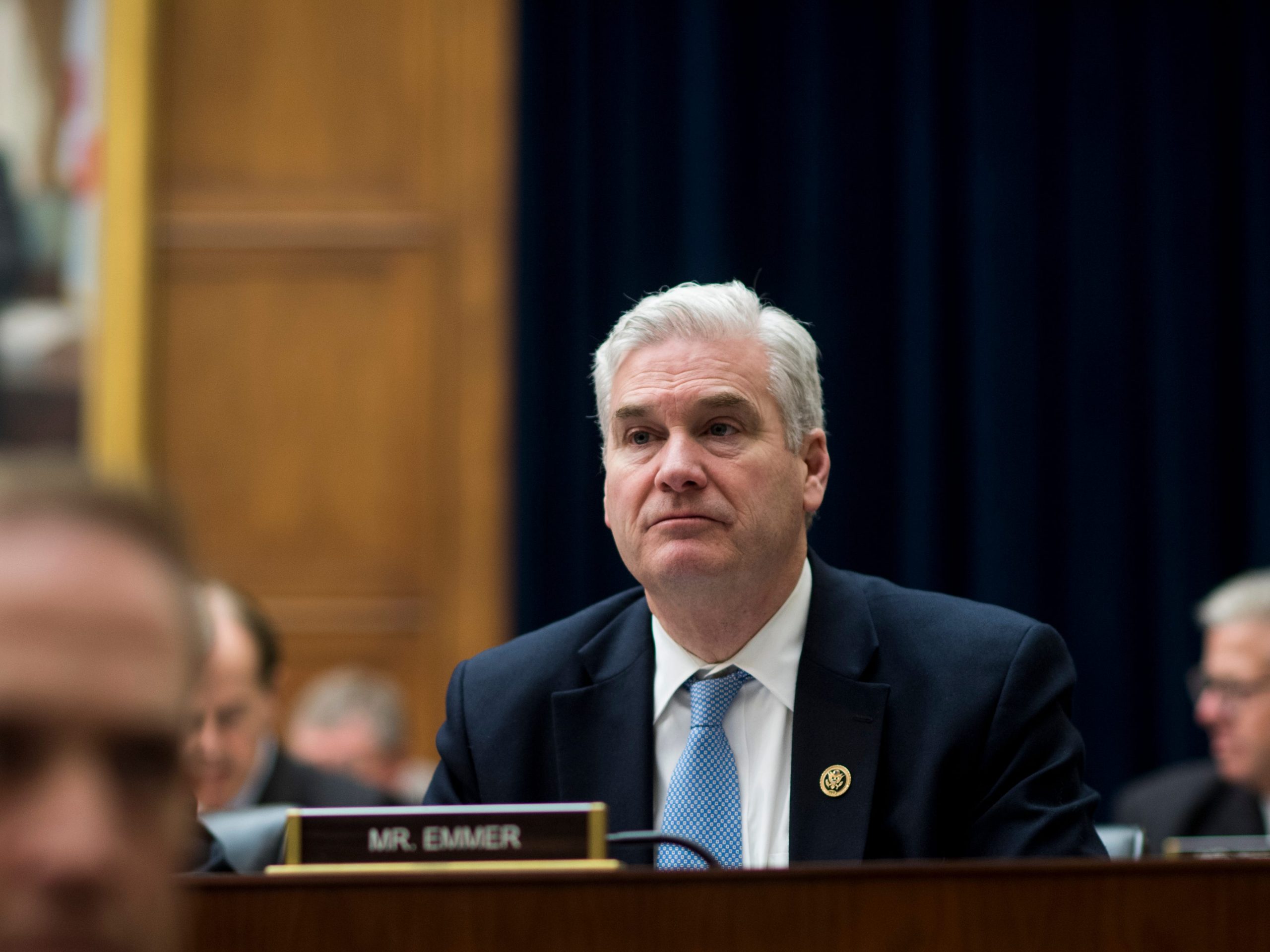 Representative Tom Emmer sitting down at the House Financial Services Committee meeting
