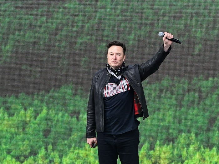 Elon Musk, Tesla CEO, stands on a stage at the Tesla Gigafactory for the open day