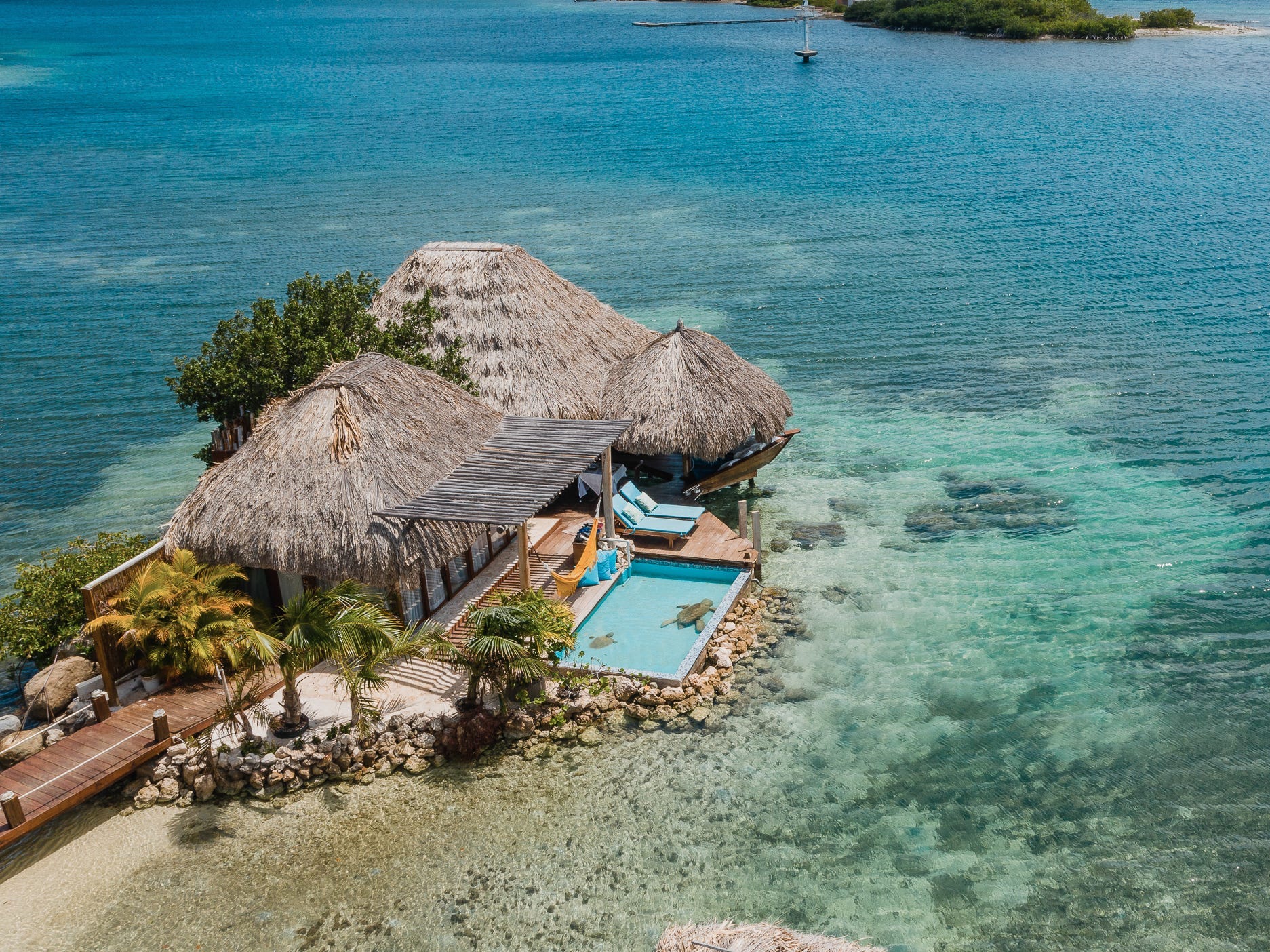 An overwater bungalow with a pool at Aruba Ocean Villas.