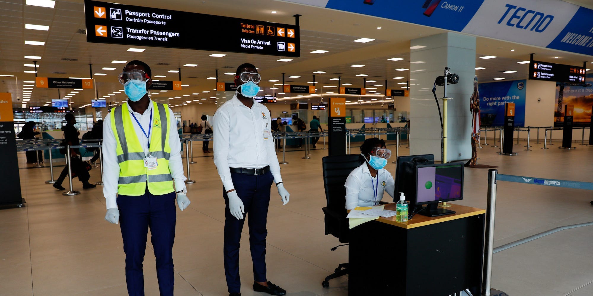 Health workers wearing goggles and masks at Kotoka International Airport