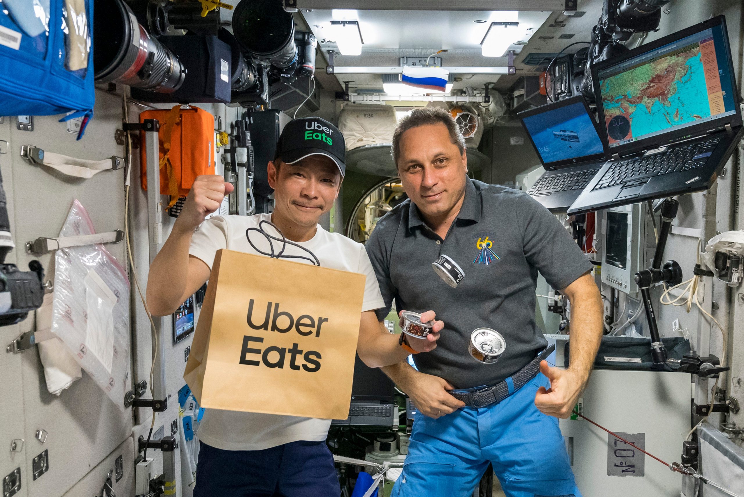 Yusaku Maezawa with an ISS astronaut and an Uber Eats delivery