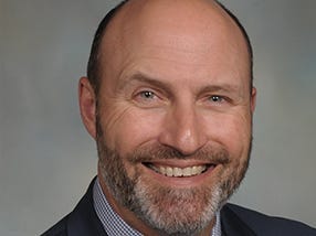 headshot of Greg Sulentic
