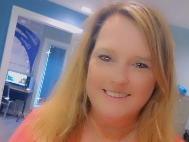 Mary Jo Lewis in a bright pink shirt