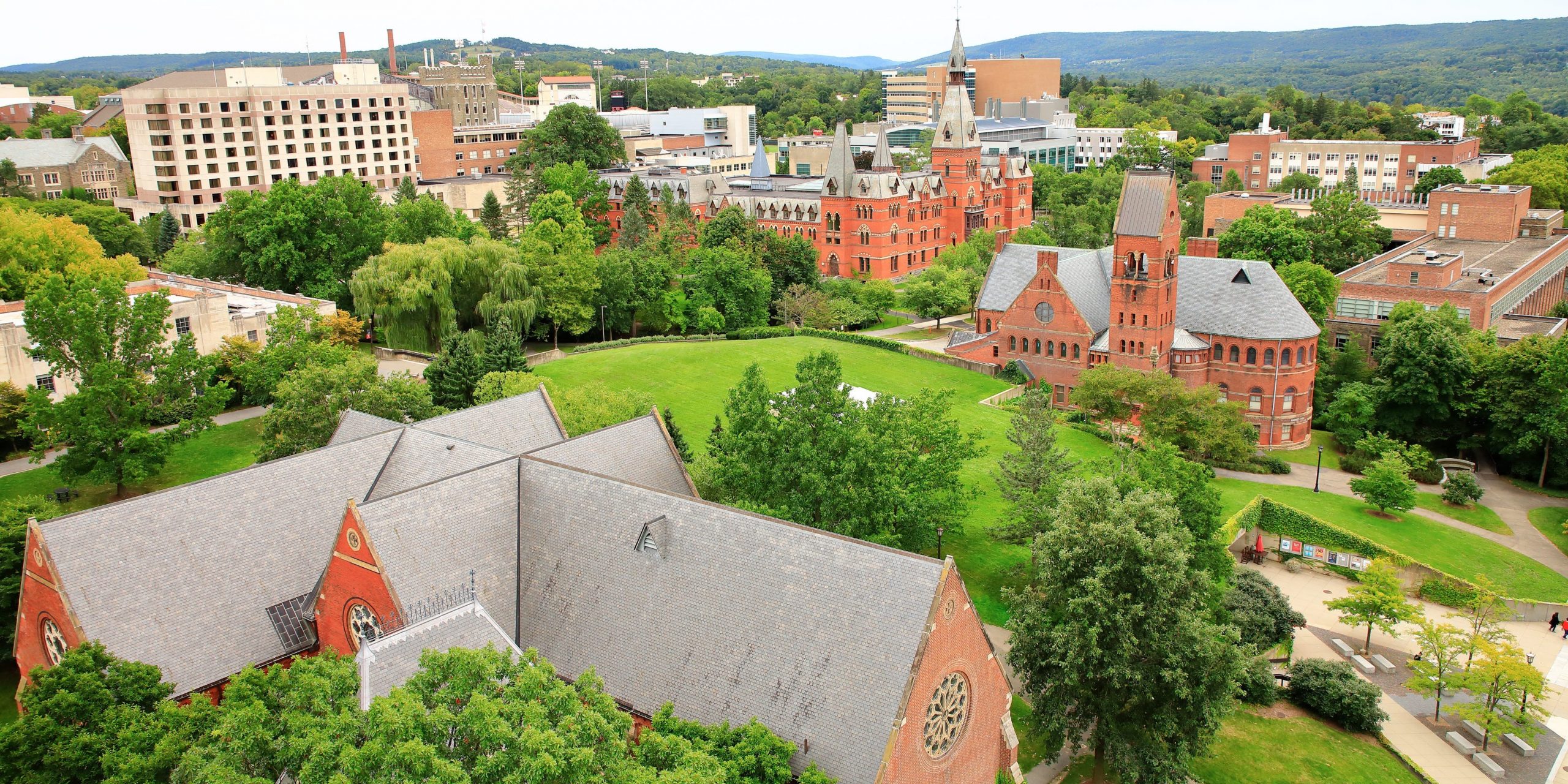 Roof top view of Cornell University campus with Barnes Hall and Sage Hall in the background.