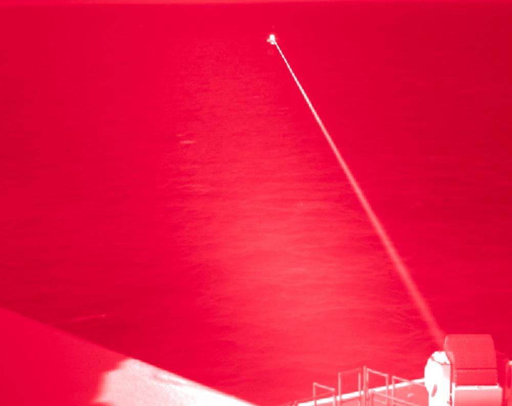 Amphibious transport dock ship USS Portland (LPD 27) conducts a high-energy laser weapon system demonstration on a static surface training target, Dec. 14, while sailing in the Gulf of Aden