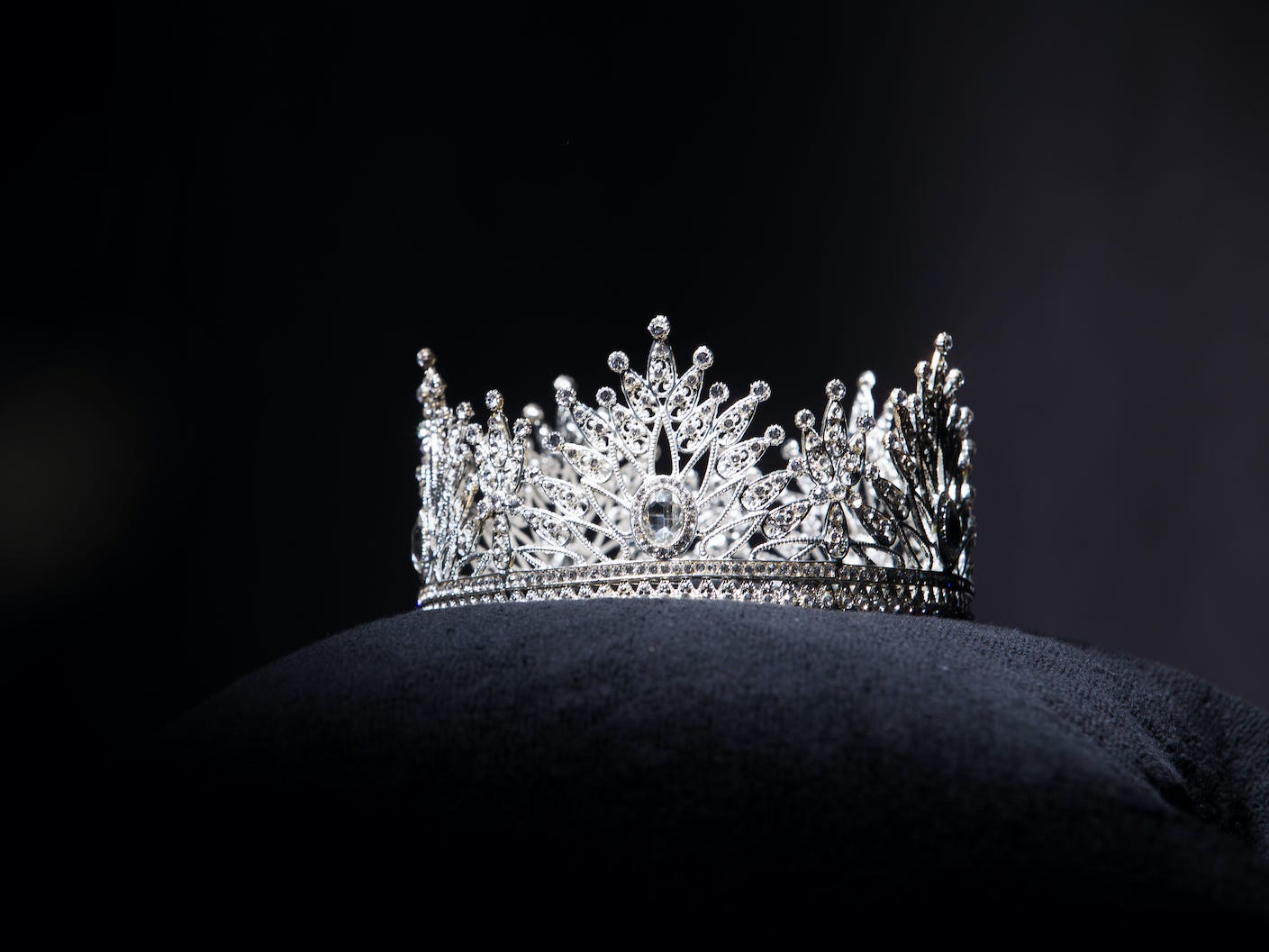 A beauty pageant crown on a pillow.