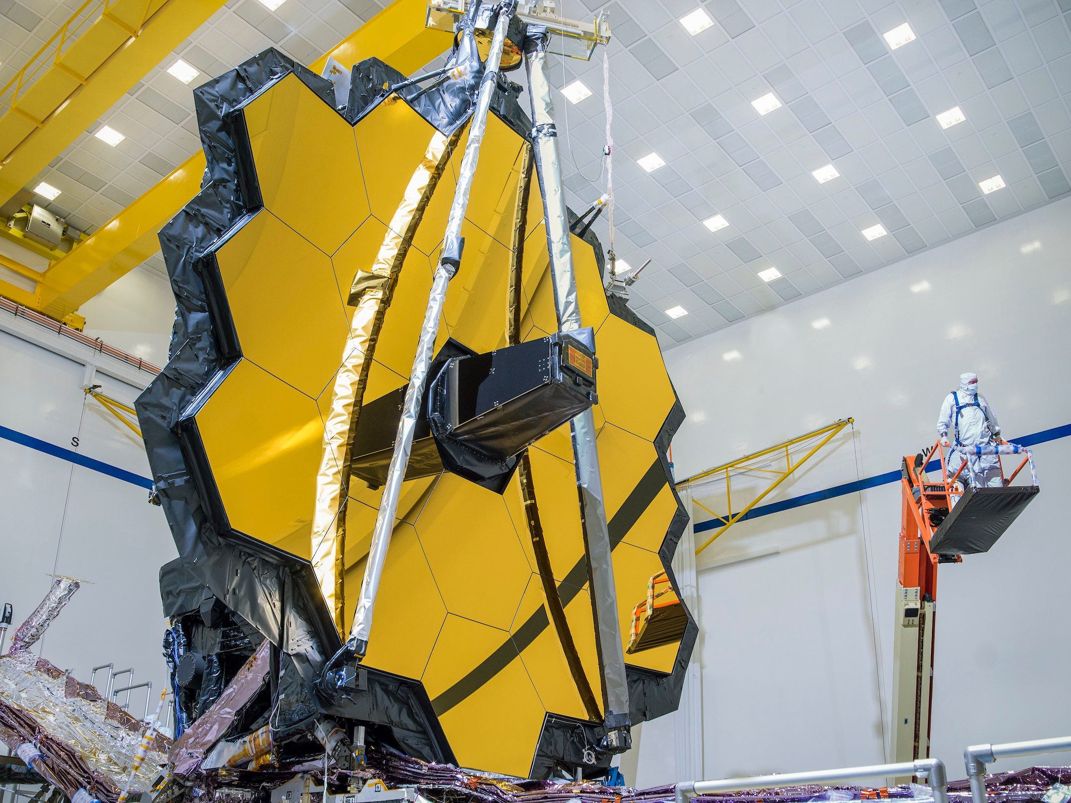 james webb space telescope gold octagon mirror in large white cleanroom