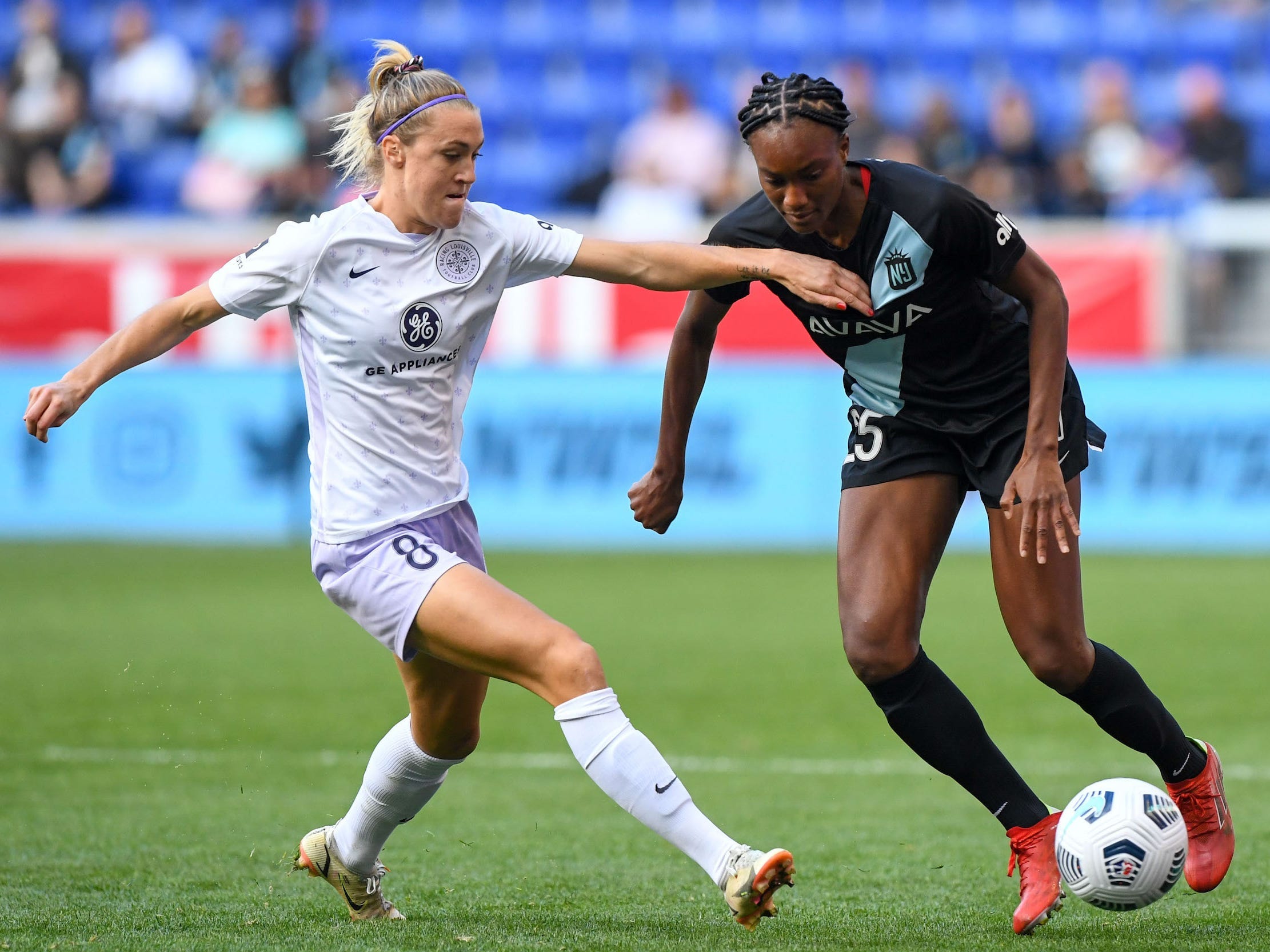 Racing Louisville FC midfielder Freja Olofsson defends against NJ/NY Gotham FC forward Ifeoma Onumonu.