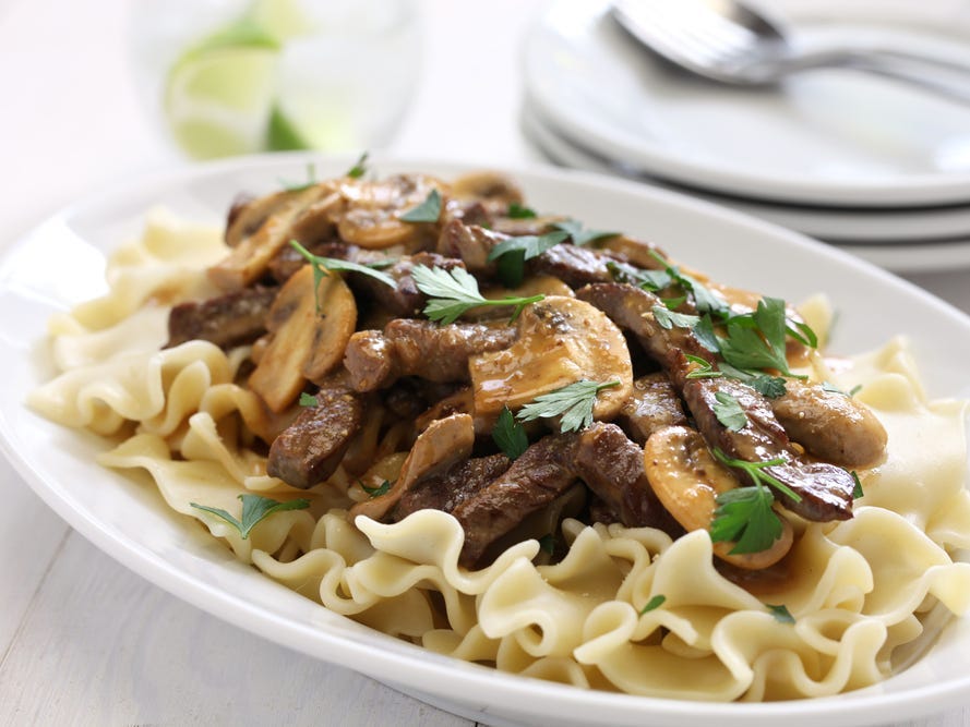 Beef stroganoff with pasta with sautéed mushrooms.