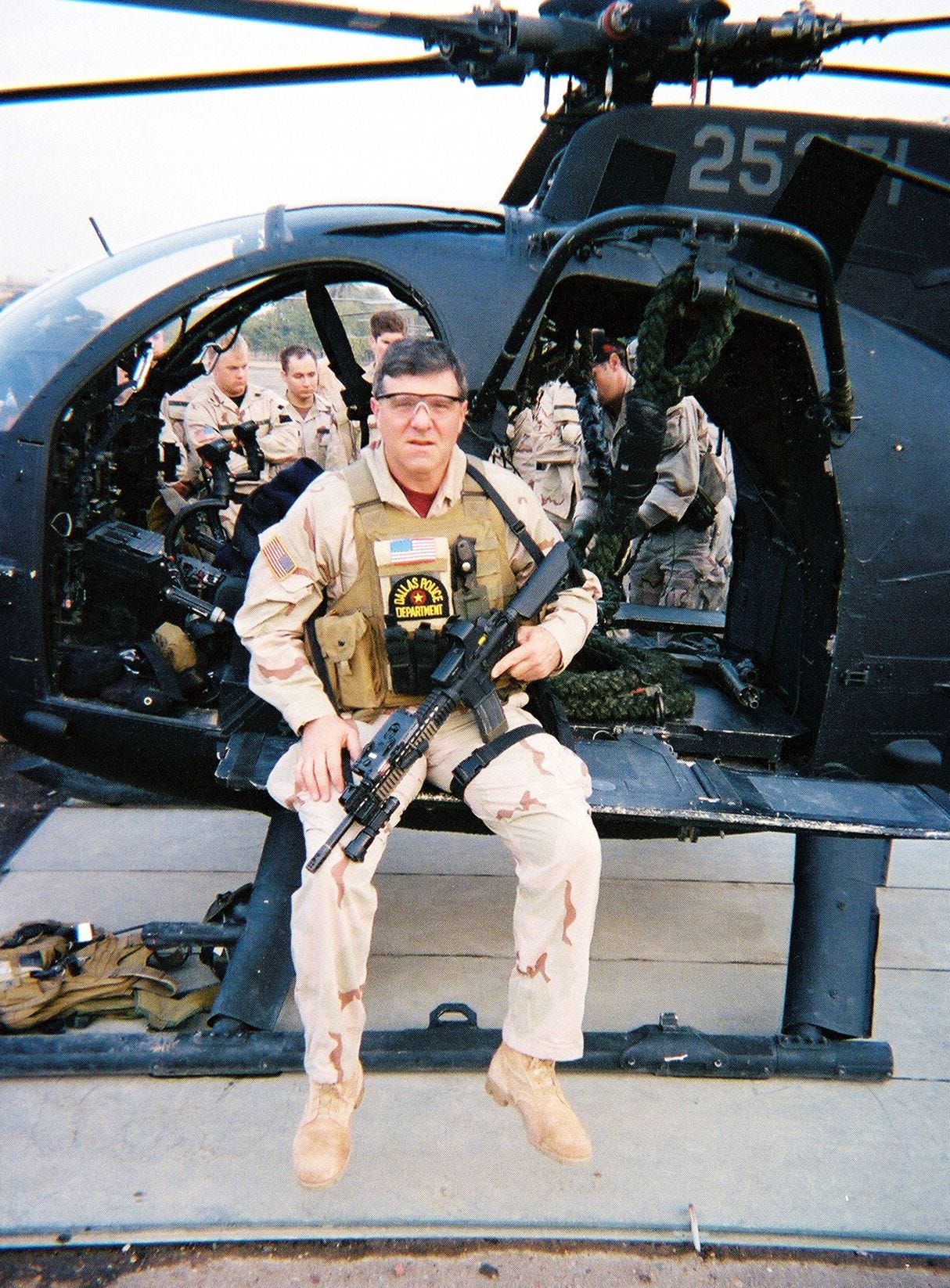 Greg Coker on MH-6 Little Bird helicopter in Iraq