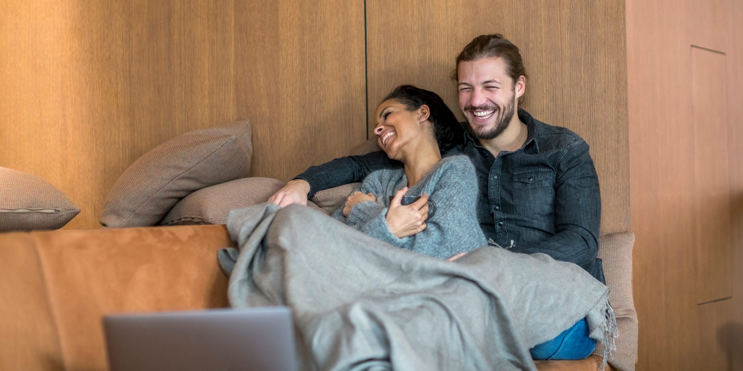 couple cuddling on the couch