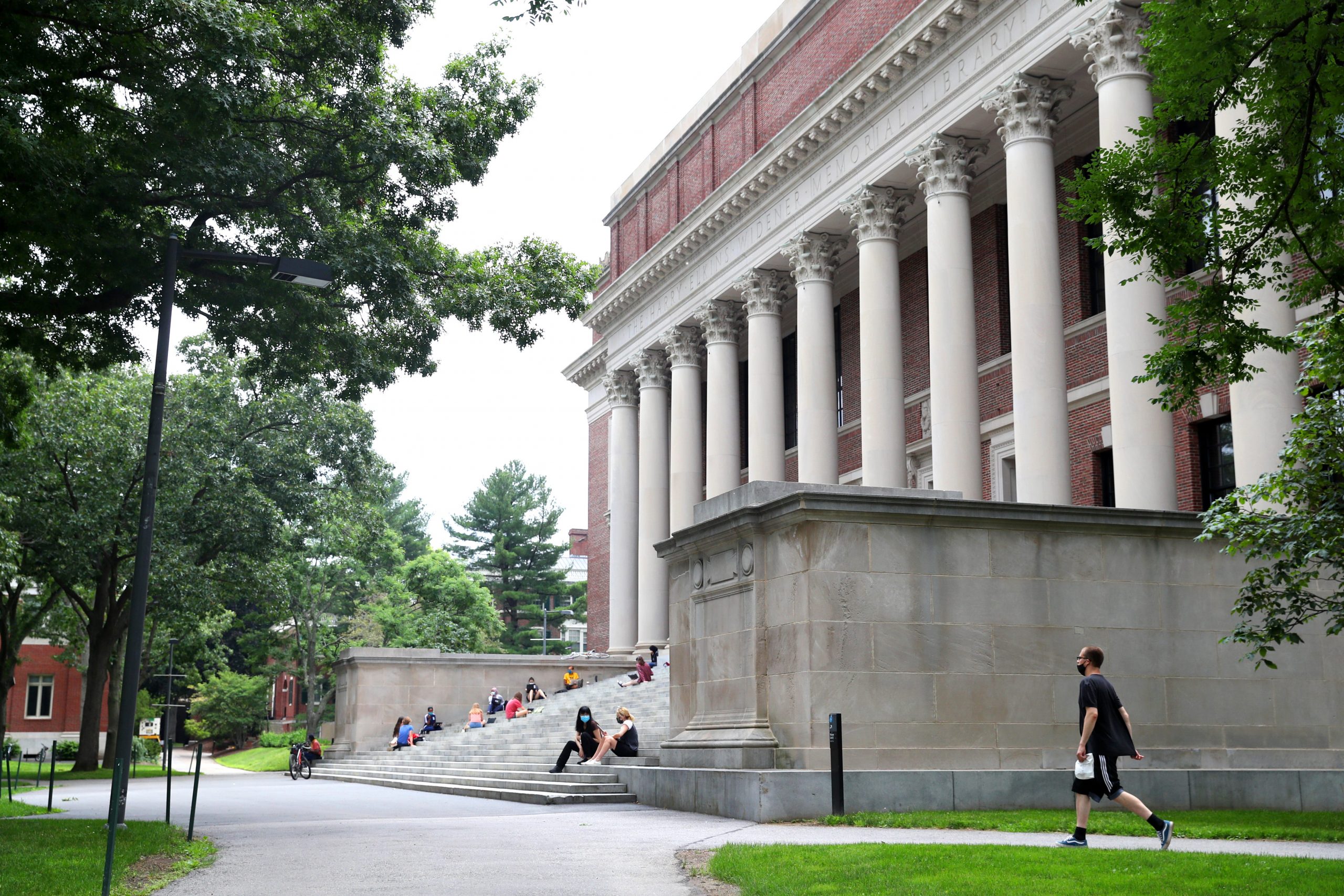 A view of Harvard Yard with students walking on campus