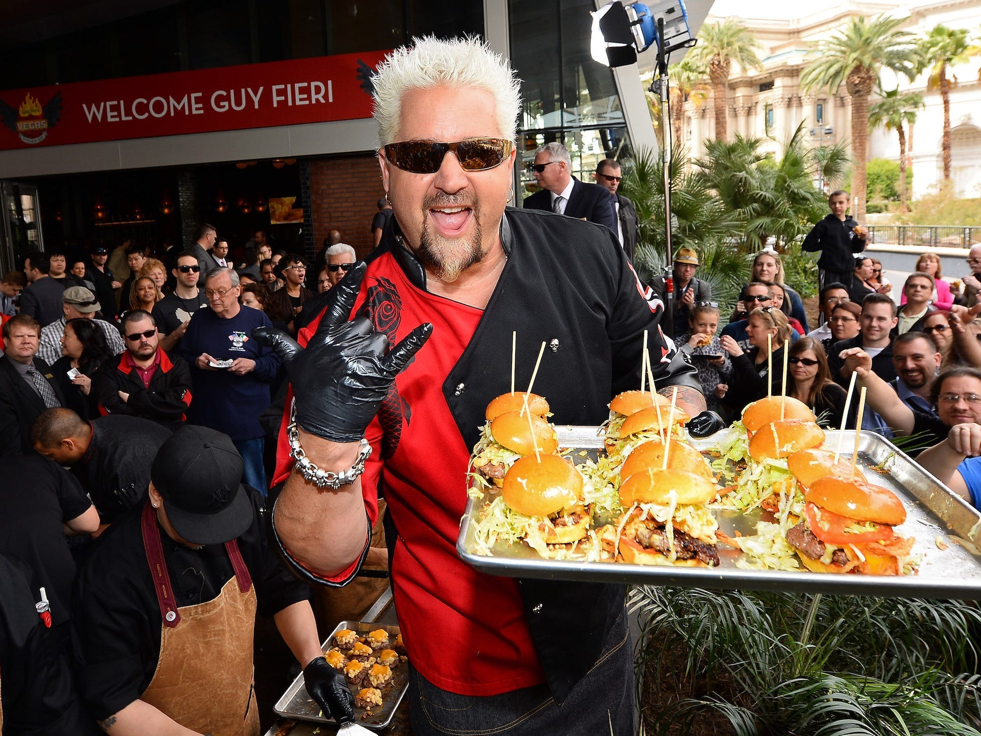 Guy Fieri with burgers