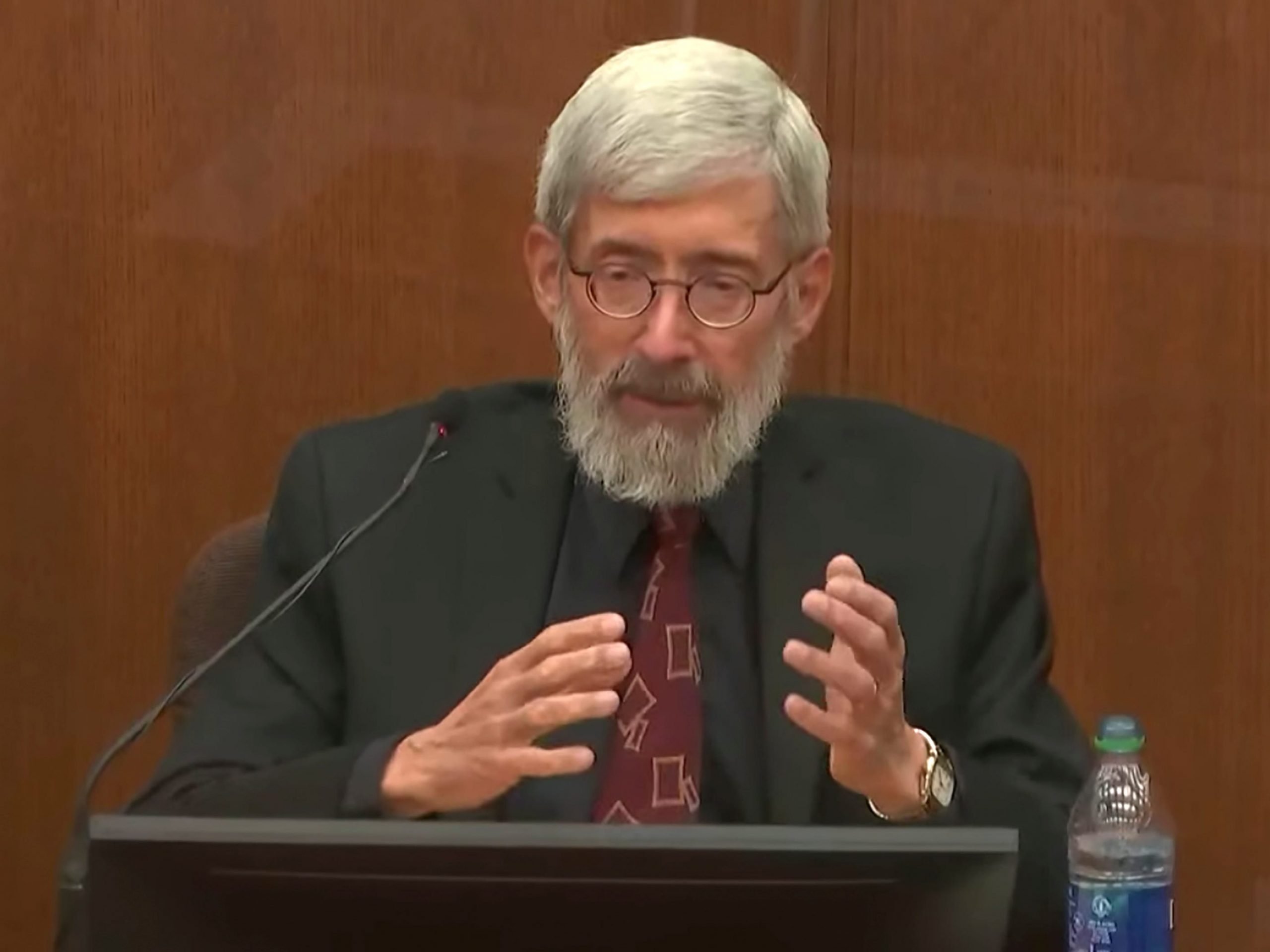 In this screen grab from video, Dr. Laurence Miller, a psychologist, testifies as Hennepin County Judge Regina Chu presides over court Friday, Dec.17, 2021, in the trial of former Brooklyn Center police Officer Kim Potter in the April 11, 2021, death of Daunte Wright, at the Hennepin County Courthouse in Minneapolis, Minn.