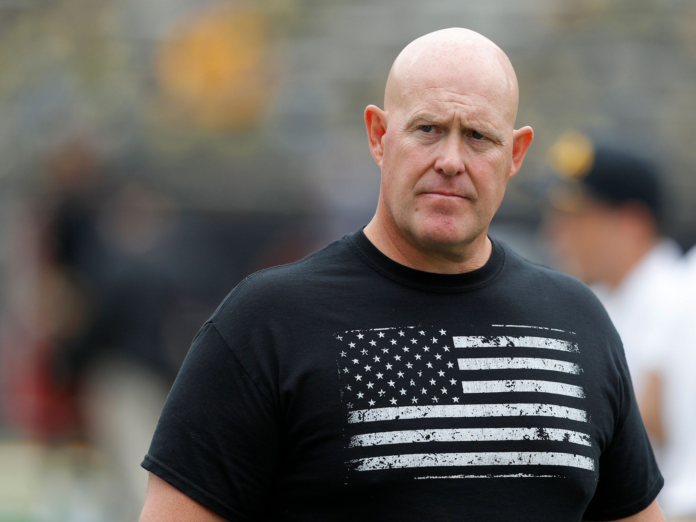 Iowa strength coach Chris Doyle walks on the field before a game in 2018.