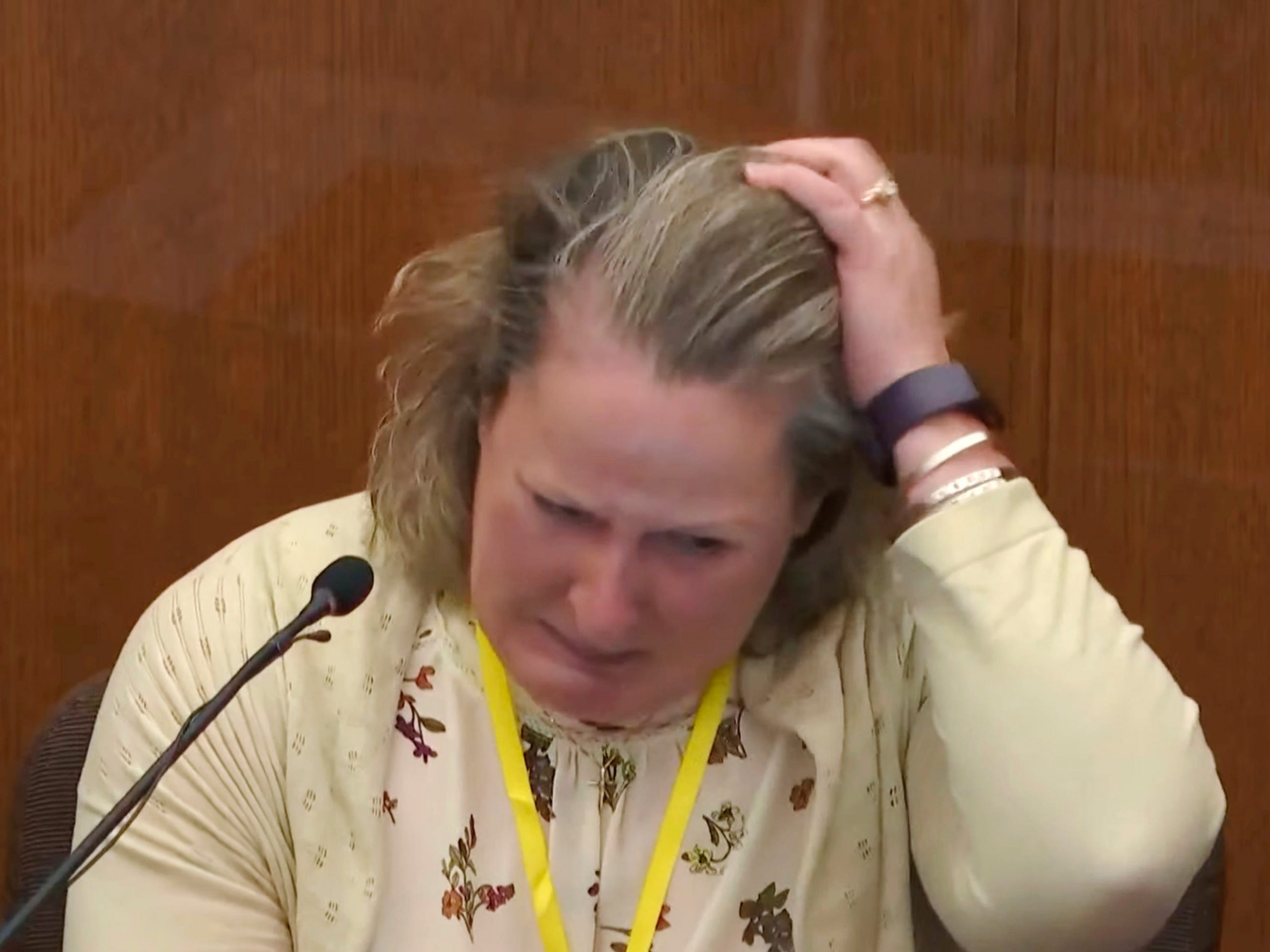 In this screen grab from video, former Minnesota police officer Kim Potter breaks down while testifying at her trial on manslaughter charges on Friday, Dec. 17, 2021.