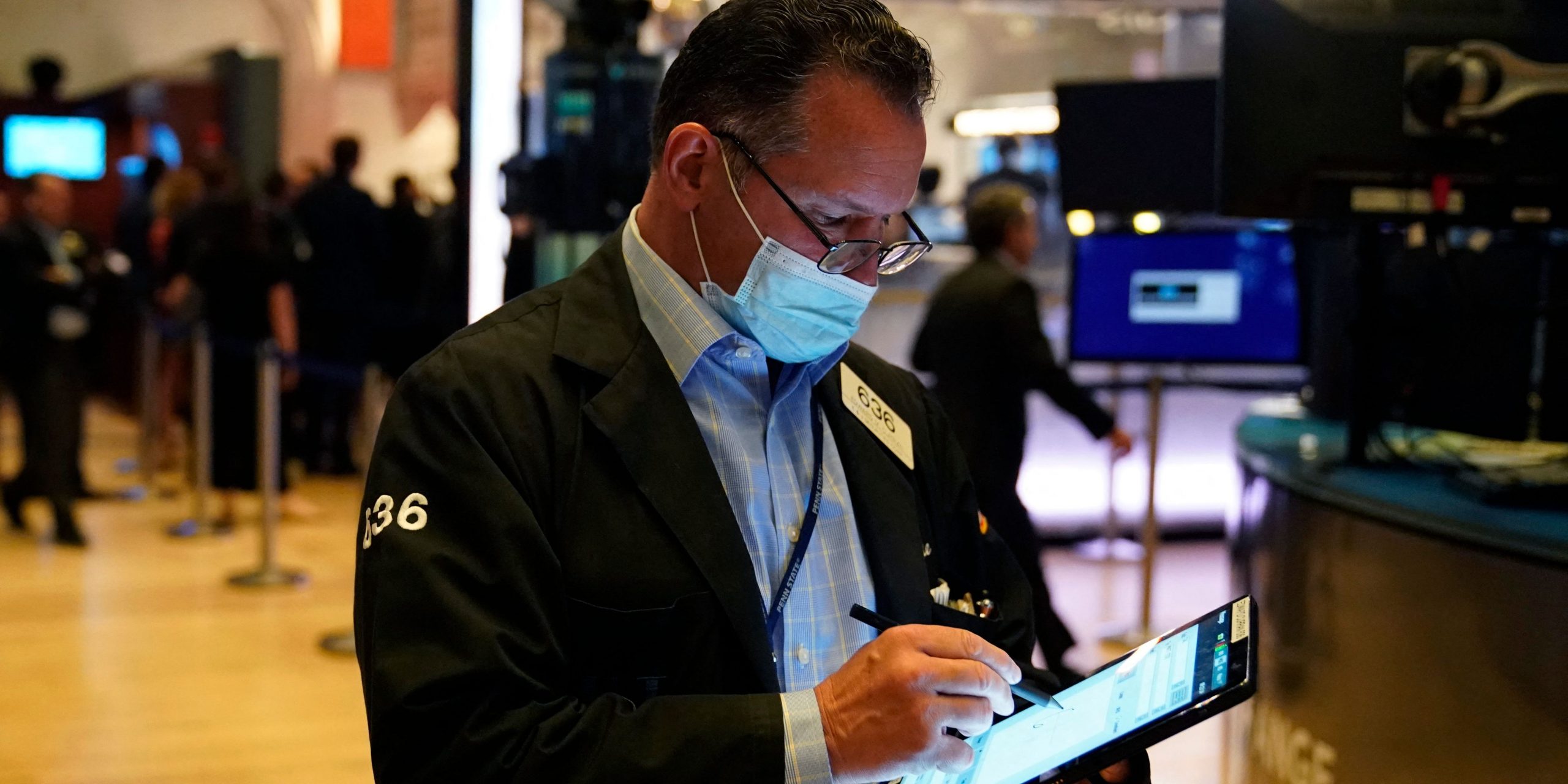 Traders work on the floor at the New York Stock Exchange in New York, on July 29, 2021.