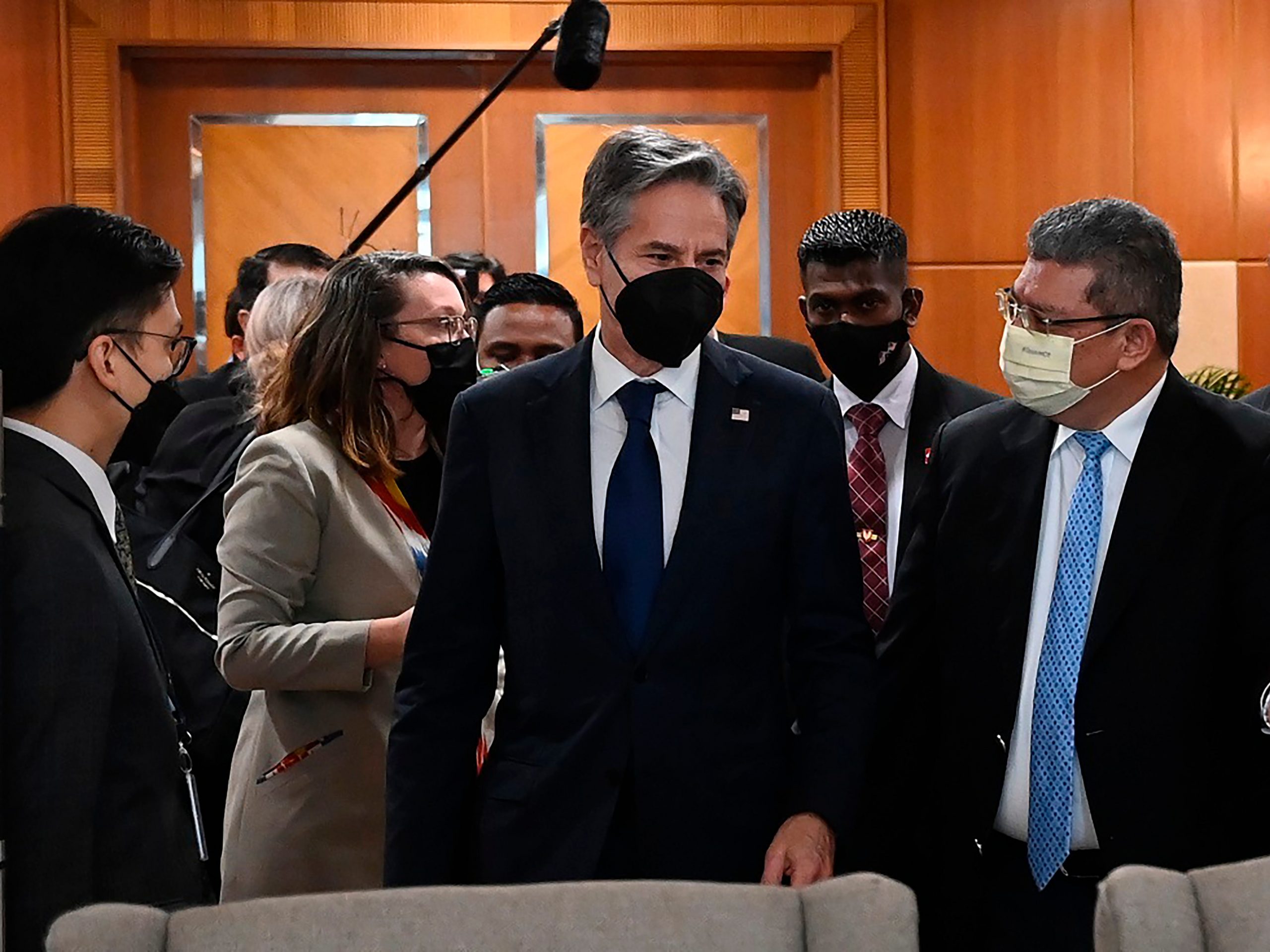 In this photo released by Malaysia's Ministry of Foreign Affair, U.S. Secretary of State Antony Blinken, center, is welcomed by Malaysian Foreign Minister Saifuddin Abdullah, right, at foreign ministry in Putrajaya, Malaysia, Wednesday, Dec. 15, 2021.