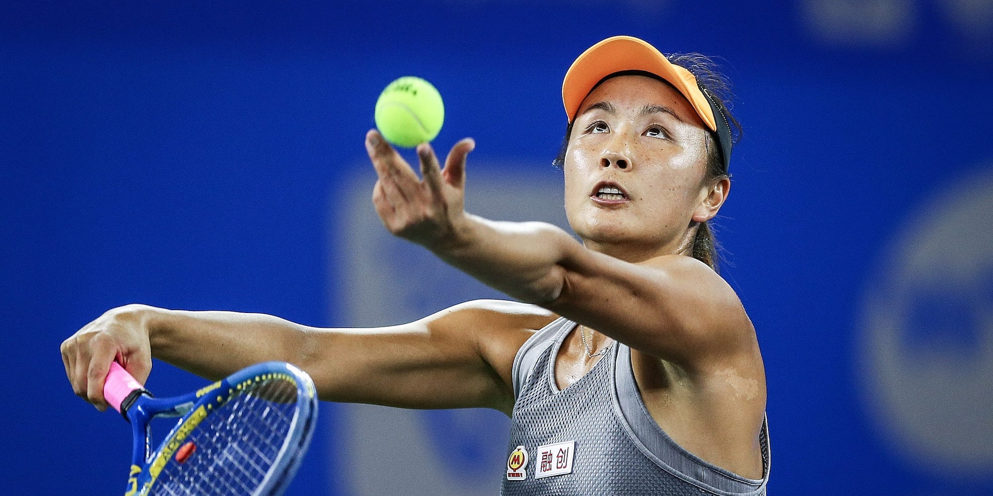 Shuai Peng of China serves during the match against Garbine Muguruza of Spain on Day 2 of 2019 Dongfeng Motor Wuhan Open