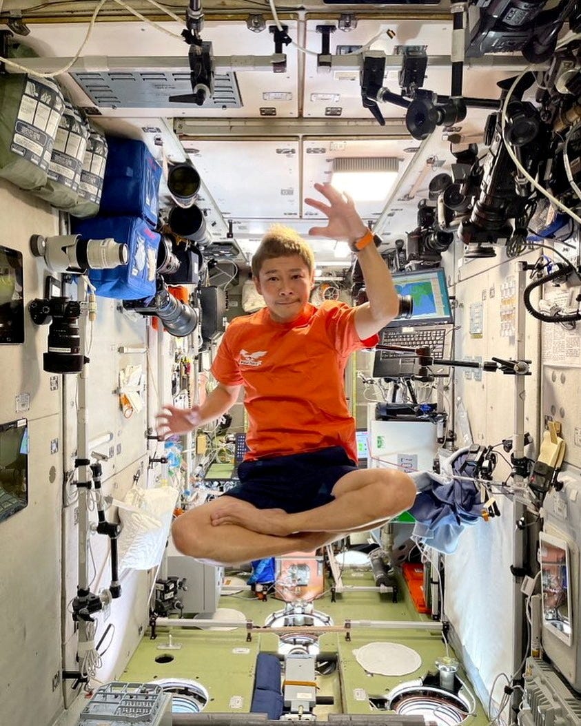 Japanese billionaire Yusaku Maezawa floats inside the International Space Station.