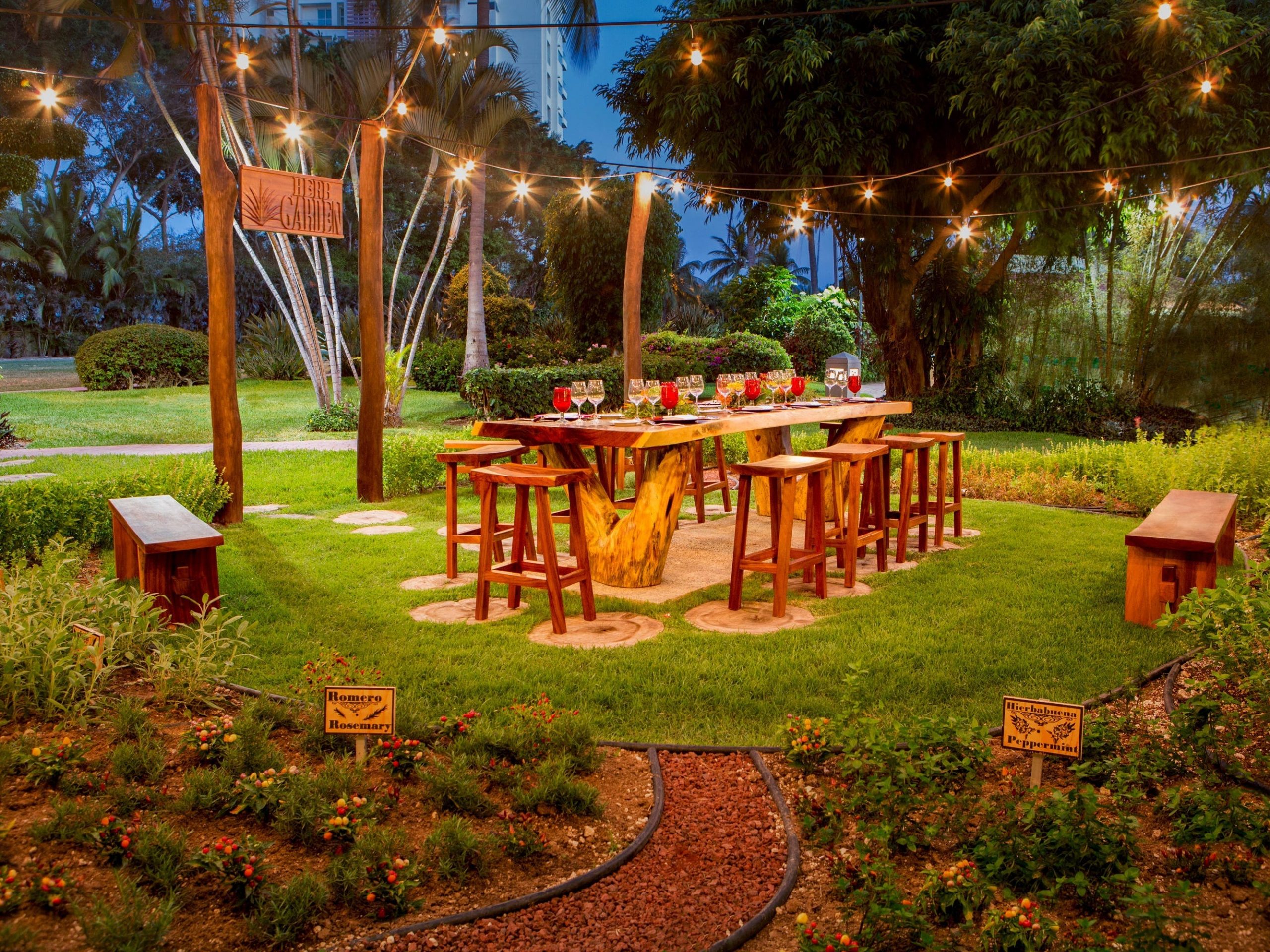 a garden outside with a table