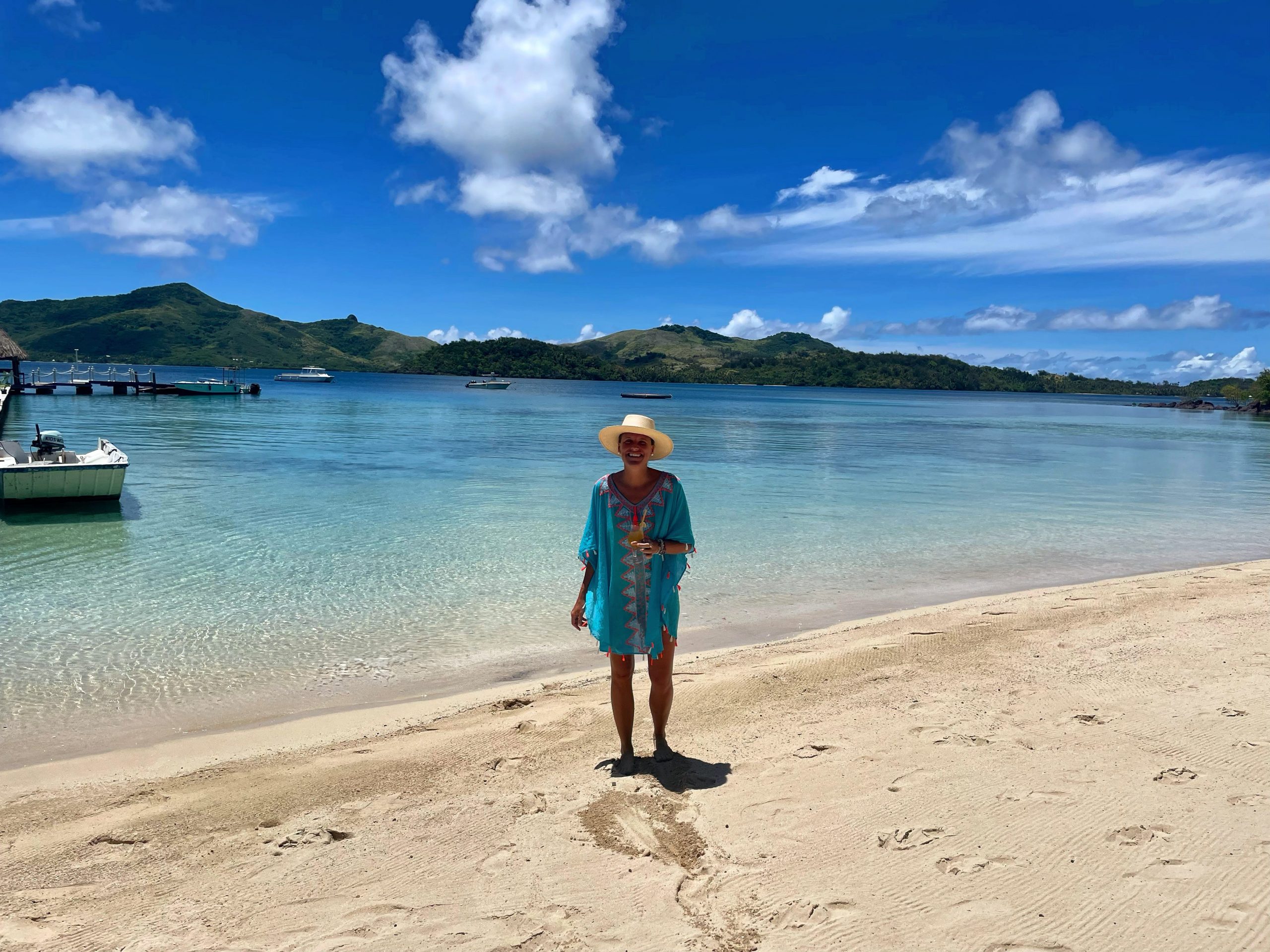 The writer in a hat on Turtle Island beach in Fiji