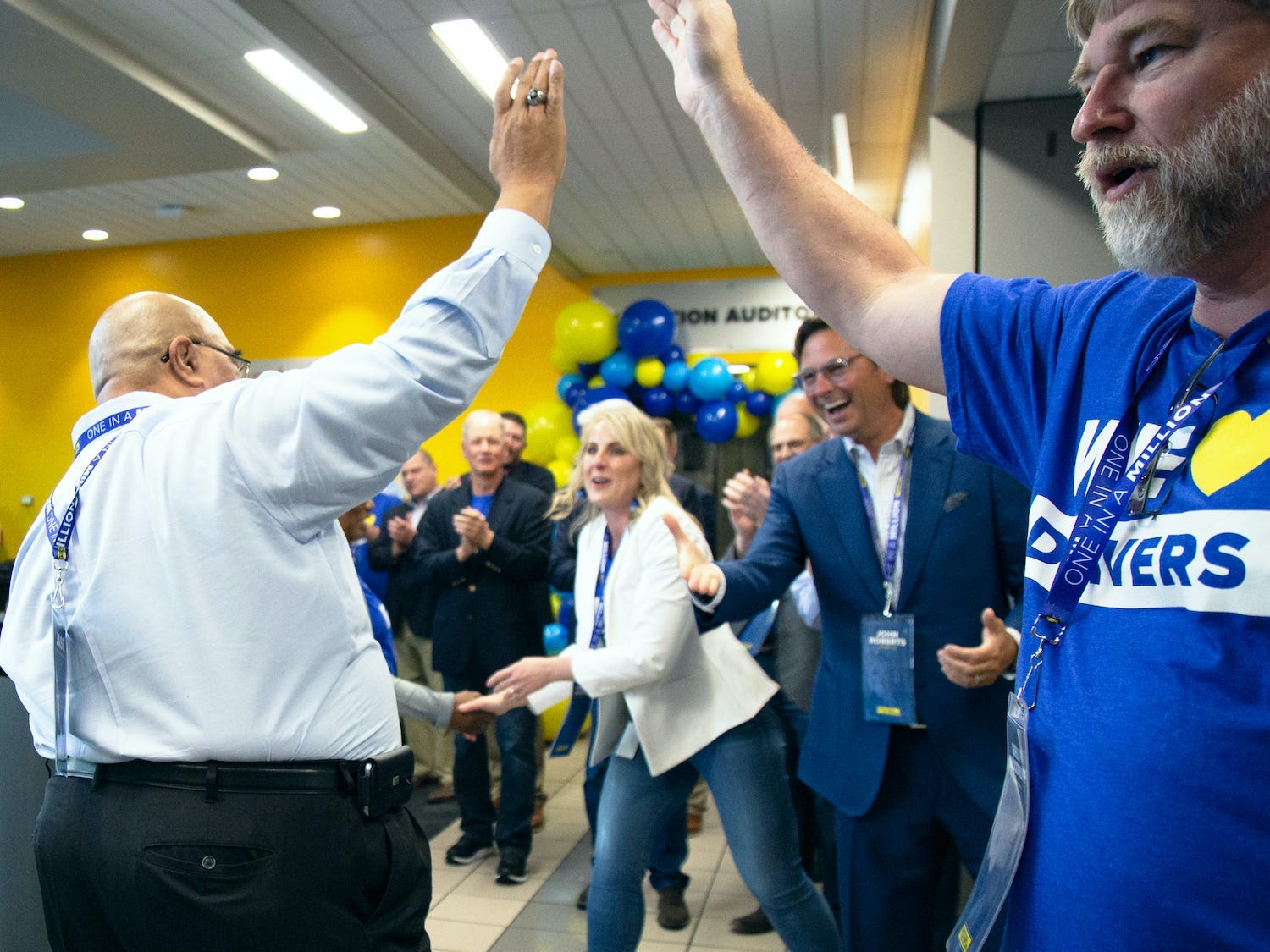 J.B. Hunt employees high-five at company headquarters