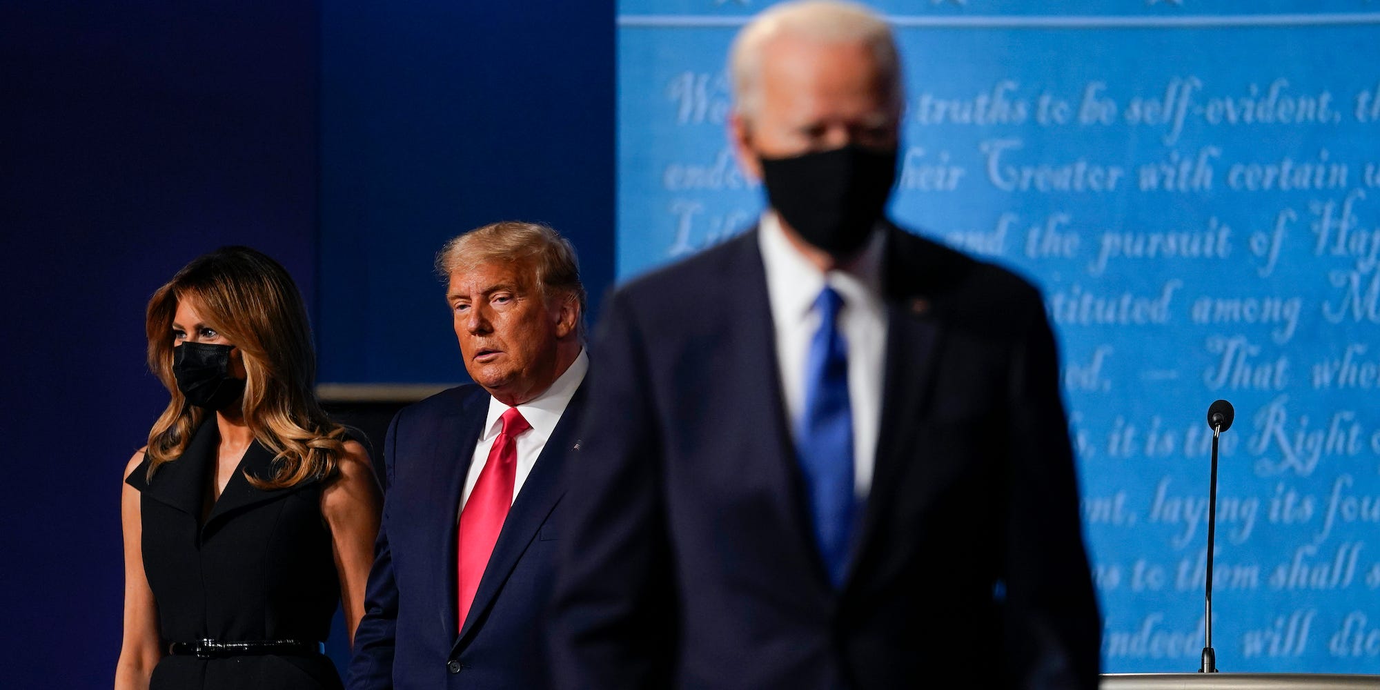 fFirst lady Melania Trump, left, and President Donald Trump, center, remain on stage as Democratic presidential candidate former Vice President Joe Biden, right, walk away at the conclusion of the second and final presidential debate Thursday, Oct. 22, 2020, at Belmont University in Nashville, Tenn.