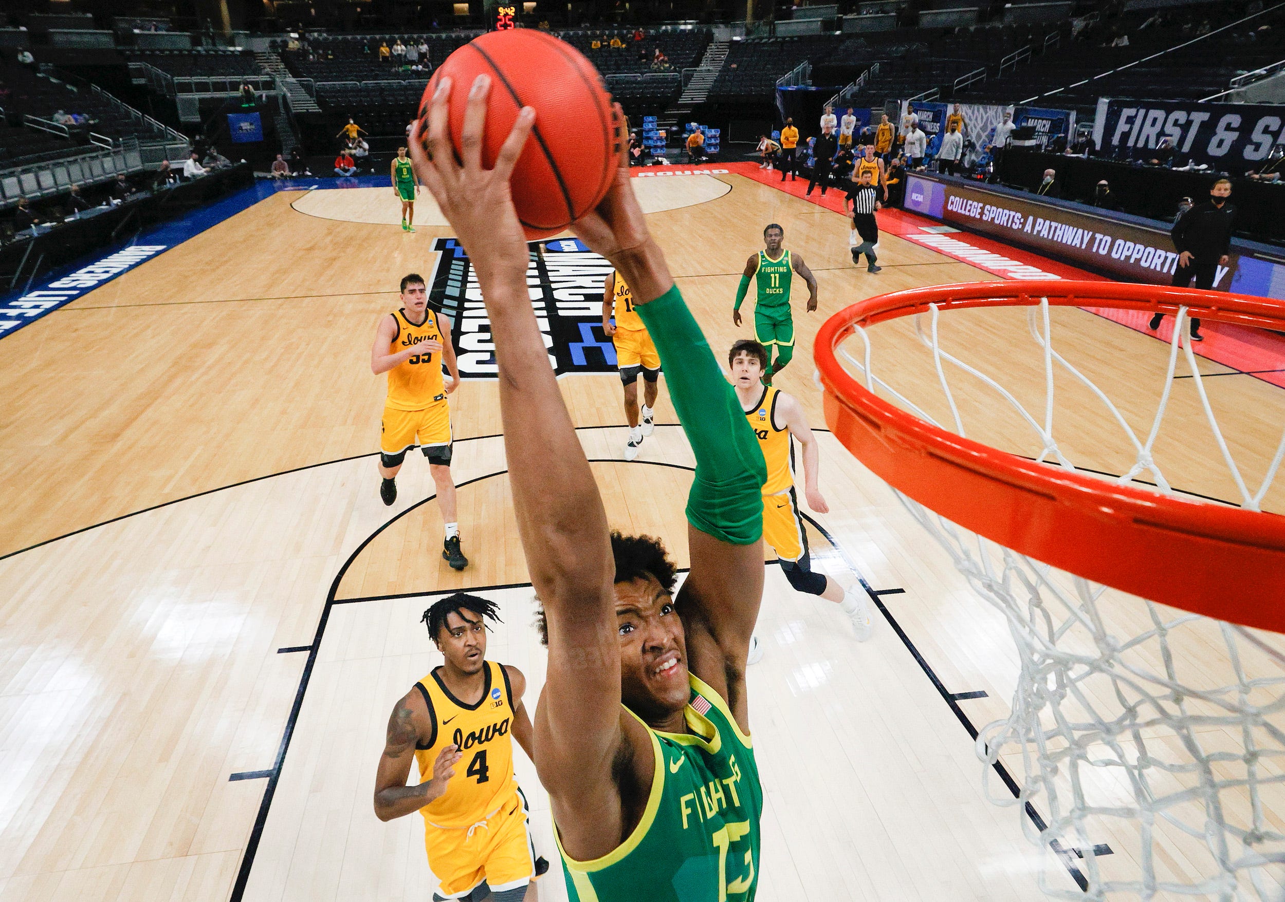 Chandler Lawson of the Oregon Ducks dunks against the Iowa Hawkeyes in the second round game of the 2021 NCAA Men's Basketball Tournament at Bankers Life Fieldhouse.